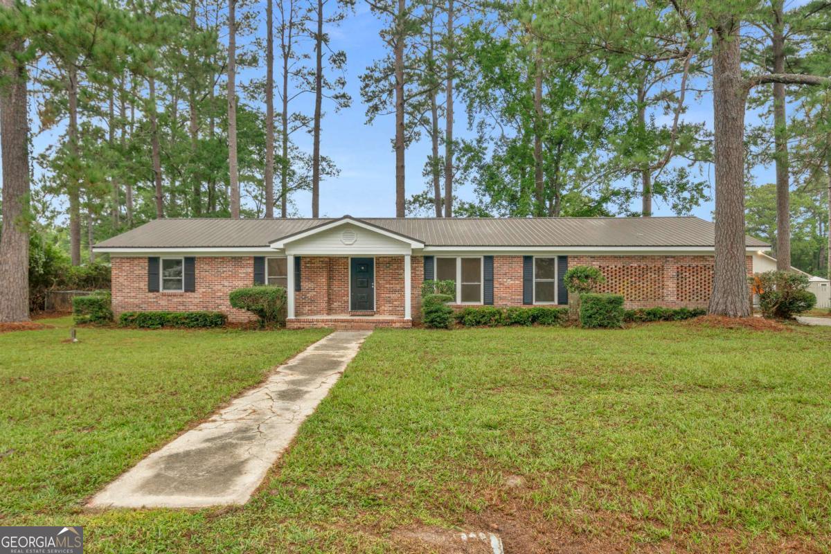 Welcome to this beautifully renovated 3-bedroom, 2-bathroom home in the heart of Waycross, just minutes from Ware County Middle School. Featuring a classic brick exterior and a durable metal roof, this residence blends timeless appeal with lasting quality. Inside, you'll find a thoughtfully updated interior designed for both comfort and entertaining. Recent renovations include new flooring, fresh interior paint, updated plumbing and drain lines, new kitchen cabinetry, modern lighting, and refreshed bathrooms. The exterior offers a welcoming yard with charming curb appeal, complemented by a fenced backyard and a versatile storage building for added convenience. Situated in a quiet, friendly neighborhood, this property provides the perfect balance of relaxation and accessibility. Don't miss your chance to make this move-in-ready home yours!