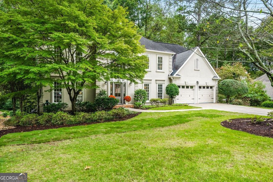 Exceptional North-East Facing Home in Hampton Woods - East Cobb's Premier Swim & Tennis Community Discover this beautifully maintained hardcoat stucco home in Hampton Woods, one of East Cobb's most beloved neighborhoods known for its active swim and tennis amenities, friendly neighbors, and top-rated schools. Elegant & Inviting Living Spaces Step into a grand two-story foyer that opens to a breathtaking great room with soaring cathedral ceilings, custom built-in bookshelves and cabinetry, a cozy fireplace, and dramatic two-story windows that bathe the space in natural light and offer tranquil views of the trees beyond.  Designed for Entertaining The formal dining room seats up to 12 guests with ease, while a separate formal living area adds sophistication to your entry. The open floorplan flows seamlessly from the family room to the breakfast area and kitchen, connected by elegant French doors. The kitchen features white cabinetry, granite countertops, and new built-in oven and microwave. French doors from the breakfast area lead to a spacious deck-perfect for hosting gatherings or enjoying quiet mornings outdoors.  Private Owner's Retreat The owner's suite is a true sanctuary, offering a large bedroom with a separate sitting room or office drenched in natural light. The resort-style bathroom includes a soaking tub, separate shower, dual vanities, and two toilets for added convenience. Generously sized secondary bedrooms feature updated bathrooms and ample closet space, ideal for family or guests. Large bedroom and bathroom on main for guests.  Versatile finished terrace level offers a large open space perfect for a media or family room, complete with built-in cabinetry. Additional rooms include a recreation/craft room, billiard room, and a private bedroom with full bath-ideal for guests or multi-generational living. The perfect Outdoor Oasis: Step outside to a level backyard with a grassy play area, stone firepit, and a charming playhouse-a peaceful retreat for all ages. This Prime Location of Hampton Woods known for its community events, welcoming atmosphere, and proximity to nature trails, shopping, dining, and major highways including GA-400, I-75, and I-285. Minutes from Sandy Springs, Roswell, and located in some of Georgia's top-ranked schools, this home offers the perfect blend of luxury, lifestyle, and location.