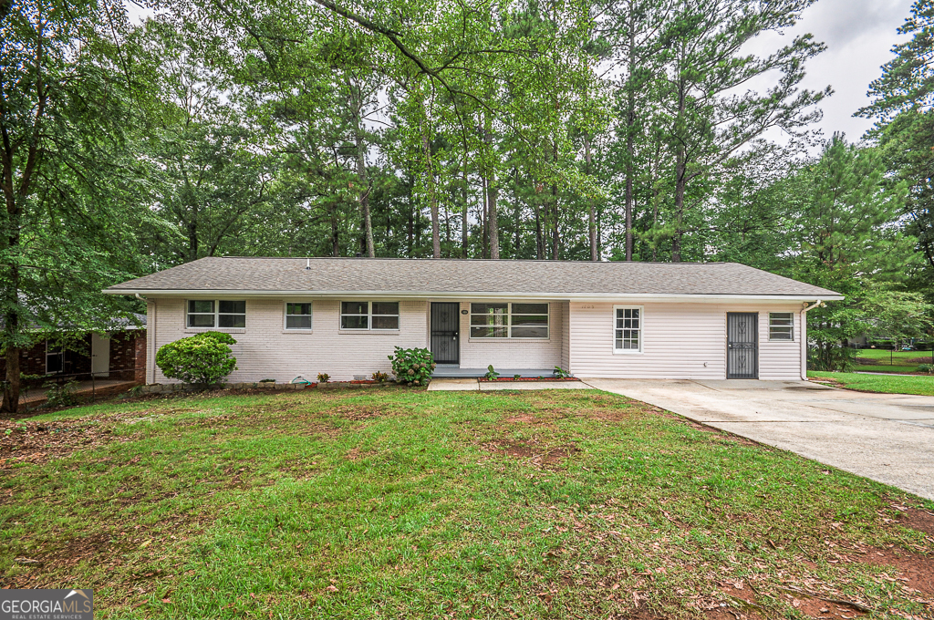 Welcome to 1705 Atherton Dr, Decatur, GA 30035! This charming 4-bedroom, 2-bathroom corner lot home offers incredible value and is move-in ready. Nestled in a peaceful subdivision, it promises tranquility and privacy. Recently installed a new roof and HVAC system, ensuring worry-free living., Freshly painted exterior and interior for a pristine look. Two spacious living areas with a mix of wood and ceramic flooring. A small attached storage room provides convenient additional space. Separate entrance to a bonus room, ideal for a home office or guest suite. Ample walking closets throughout for efficient storage. Updated kitchen boasting new cabinets and majestic granite countertops. Just a short 15-minute drive from downtown Atlanta, combining suburban calm with urban convenience. This home has been completely remodeled, offering peace of mind to its new owners with its updated features and systems. Don't miss out on this opportunity to own a home that blends modern comfort with serene living. Schedule your showing today!
