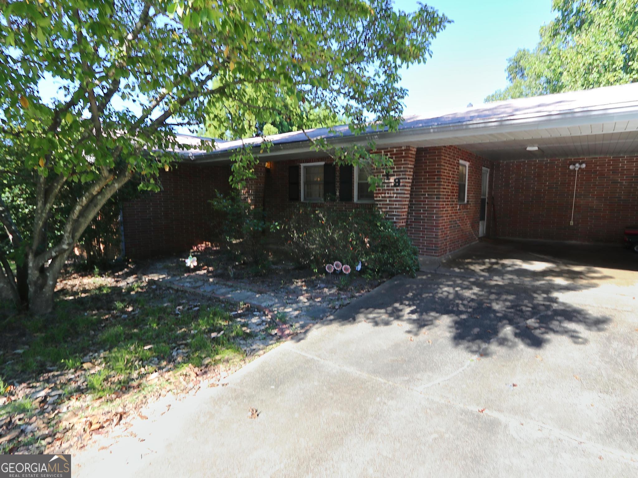 This 3-bedroom, 2 bath home with formal dining room and bonus room offers a spacious layout designed for both comfort and functionality. The beautifully updated kitchen features a large island, bar seating, sleek countertops, and lots of cabinets. It opens to a generous living area with built-in shelving and a brick fireplace. The bonus room provides flexible space for an office, craft room, or playroom. Extra storage room off of the large laundry room could be pantry or small game room. Backyard features fenced area with a deck and shed. Shingles replaced approximately 2020.