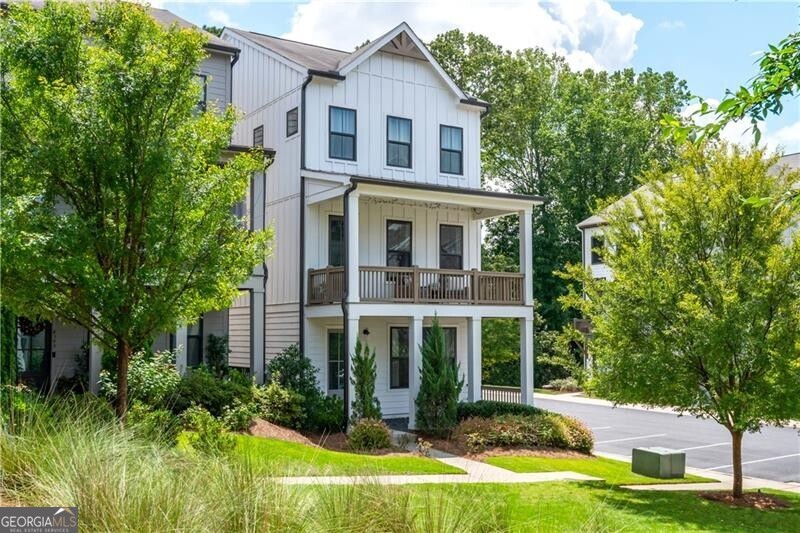 Looking for a beautifully quiet lifestyle right in the middle of one of Atlanta's hottest areas? Look no more. This incredible home is the epitome of vibrancy and privacy! Tucked away in a quaint community minutes from The Battery, Vinings, Smyrna, West Market Village, Chattahoochee Parks, and West Midtown, this home can't get higher marks for location! This home in-particular sits on one of the best lots in the entire neighborhood, fully facing the private park, tucked back off the main road, sitting at the very end of the row of homes, and has the highly coveted double front porch - tripling your outdoor space compared to other homes! Inside offers the perfect blend of style, space, and convenience with a light filled flexible floor plan. On the main floor there is a full two car garage, bedroom and bathroom that is a perfect place for a home office, gym space, or use as the third bedroom if needed, and a spacious foyer and mud room. On the main living floor, there is the large open plan with private wooded and park views from front to back! Centered in the heart of the home is the gourmet kitchen with quartz countertops, stainless steel appliances, painted wood cabinetry, huge island, and designer fixtures - on one side there is a large dining area with access to a rear porch, perfect for growing herbs and having coffee, and on the other a spacious and airy living room with beamed ceilings, huge windows, and access to that incredible covered porch that overlooks the park. Upstairs, there is an oversized primary bedroom with double vanity bathroom, huge shower, big walk-in closet, and more natural light with park views. On the other side of the home is another full bedroom and full bathroom, perfect for kiddos, secondary office, or guest bed when the guests just won't leave. Some great bonus features include TWO water heaters so your showers can be as long as your podcast, bidets on each toilet to stay squeaky clean, ALL appliances stay with the home (yes that means washer, dryer, and refrigerator!), systems that are barely over 5 years old so you don't have to worry about selling a kidney to get all new HVACs and roofing, and high walkability to get your steps in (or close enough for a fast uber and doordash). This home is the perfect fit for so many people and lifestyles, but the real question is who will be first to the table?