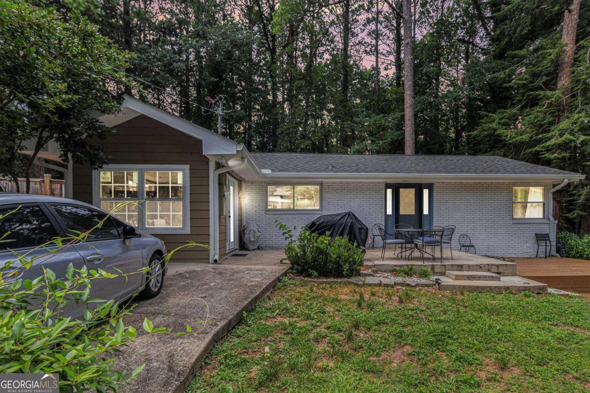 Step into a peaceful retreat where charm, comfort, and convenience come together in perfect harmony. This thoughtfully updated home features three bedrooms, including a versatile bonus room that can easily serve as a home office, creative studio, guest space, or cozy den-designed to adapt to your lifestyle. Recent upgrades add tremendous value and peace of mind: a brand-new roof, a spacious new storage shed, and a newly built deck ideal for relaxing outdoors or entertaining guests. Whether you're sipping your morning coffee or hosting a weekend barbecue, the outdoor space is ready to be enjoyed year-round. Located in the beloved Pine Lake community, you're just minutes from all the essentials. Grocery stores, local markets, and shopping destinations are conveniently close, making daily errands a breeze. From fresh produce and neighborhood cafes to eclectic boutiques, everything you need is right at your fingertips. Set in a quiet, walkable neighborhood known for its natural beauty and vibrant artistic spirit, this home offers the perfect blend of small-town tranquility and urban accessibility. It's more than just a place to live-it's a lifestyle centered on comfort, flexibility, and community in one of metro Atlanta's most unique and welcoming enclaves.
