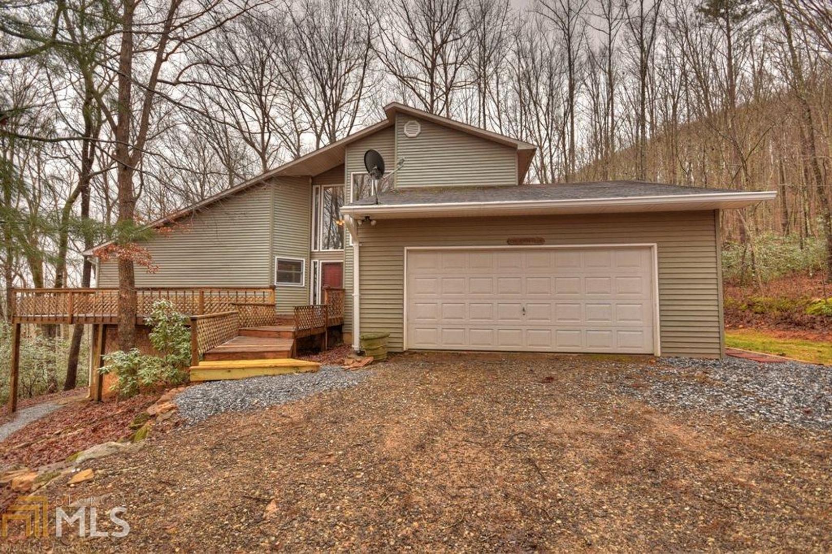 This one has it all! Great full time home, close to town, w/ plenty of space for living inside & out! This house sits on 4.05 beautiful wooded acres w/ long range mountain views, & plenty of space to enjoy your privacy. The property has loads of beautiful hardwood trees, wild mountain azaleas & mountain laurel which gives you an explosion of color in the spring. The house features a large kitchen, w/ dining area & breakfast bar, a wonderful great room w/ a franklin wood burning stove, laundry room, one master bedroom suite, a 1/2 bat for guests. The 2 car garage is off the main level. There is a 2nd master suite upstairs w/ a large master bath & jacuzzi tub, separate shower & twin vanity. The basement level features 2BR full bath, great room & kitchen.