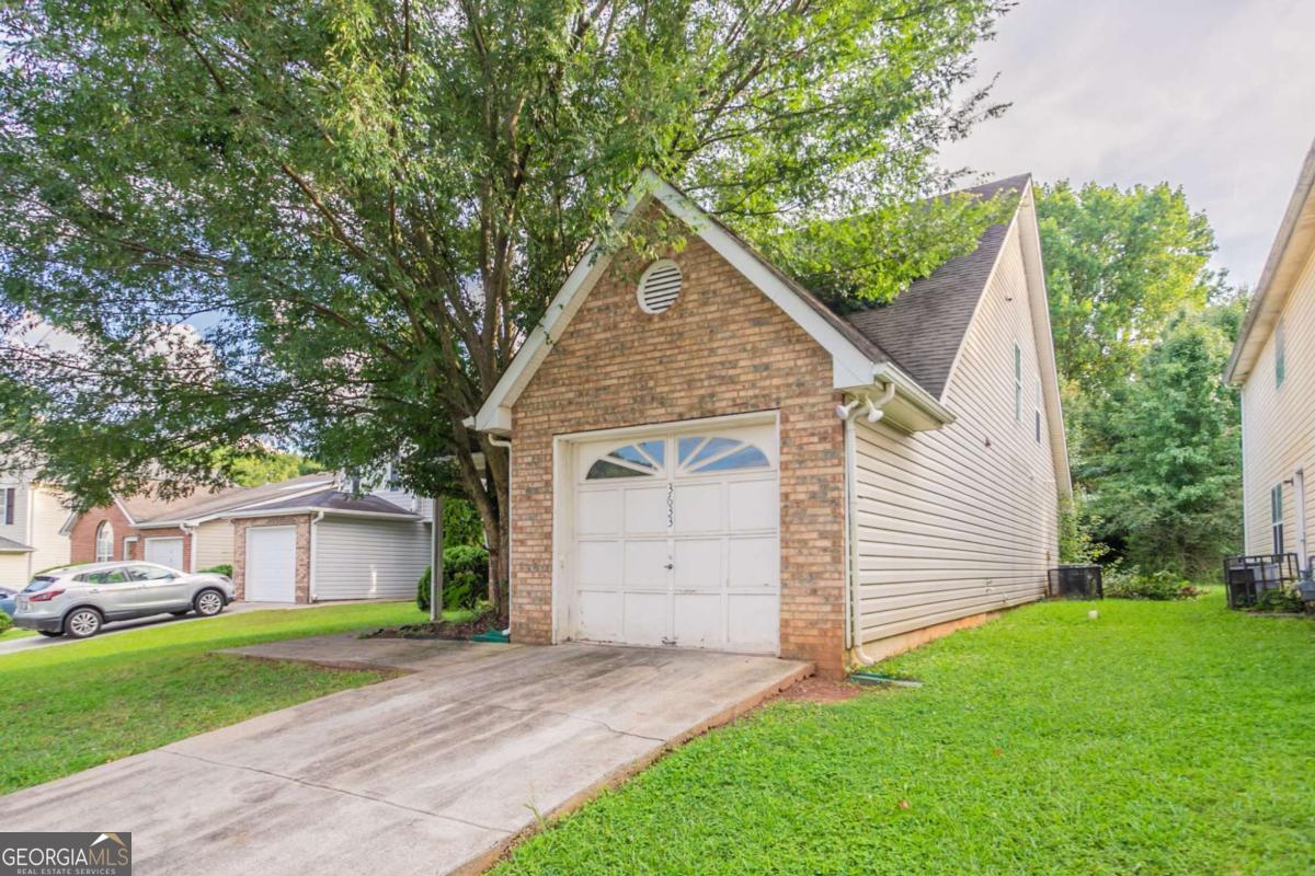 Welcome home to this well-designed property tucked into a quiet cul-de-sac in the Platina Park community. The main level features an inviting two-story foyer, open-concept living and dining areas with great natural light, and two comfortable bedrooms with a full bathroom nearby. Step outside to the private fenced patio-ideal for morning coffee or weekend gatherings. Upstairs, enjoy a private owners suite with vaulted ceilings, a soaking tub, and walk-in closet-perfect for rest and retreat. With a level backyard and no HOA, this home offers comfort, flexibility, and excellent proximity to local schools, shops, and major highways. A must-see for buyers seeking charm and value in South DeKalb.