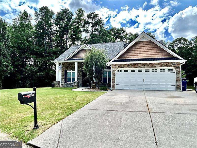 Welcome Home to this lovely ranch home with beautiful rocking chair front porch! You will love the privacy this home offers with just 6 homes in this subdivision, you have a large lot and no traffic driving through! This home offers so much square footage! Over-sized master bedroom with trey ceilings and onsuite with double vanity, separate shower and soaking tub, large walk-in closet and tall ceilings! Huge family room with vaulted ceilings, separate dining room and formal living room. Gorgeous kitchen with tons of cabinets and counter space, breakfast bar and breakfast area. Two spacious secondary bedrooms with large closets. Home also offers a full finished basement, perfect for mother-in-law or teen suite. Terrace level has family room/media room, 3 bedrooms, full kitchen, washer and dryer, exercise room, boat door and storage. You can also sit out on your large back deck and enjoy the peace and quiet or sit under the back patio and relax. With this half acre lot, you have tons of space to add a pool, fire pit or other outdoor living space.