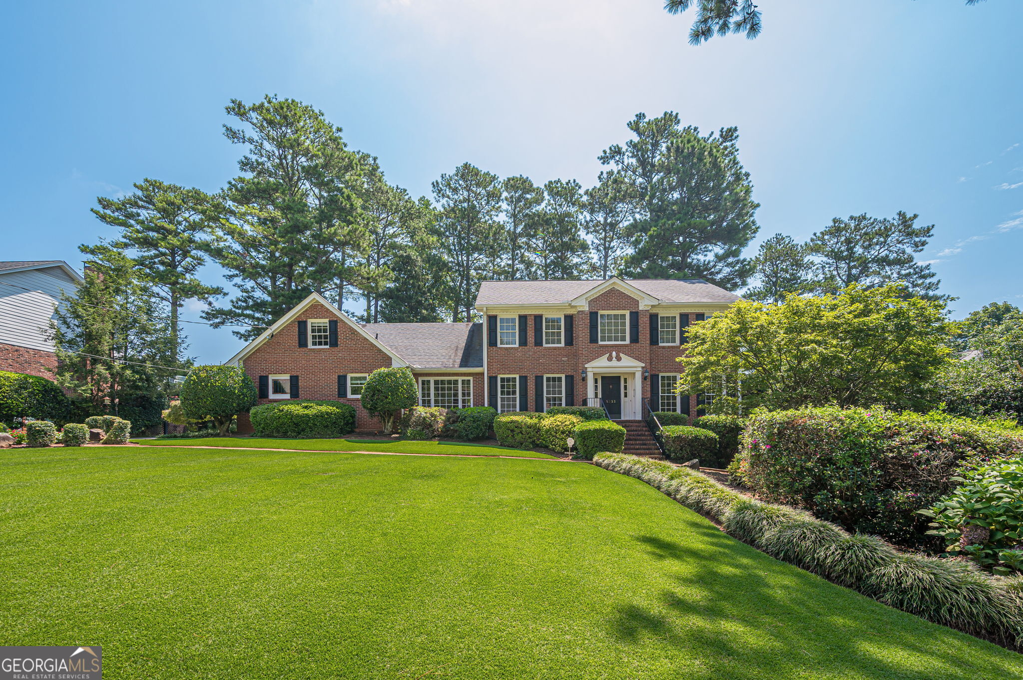 Welcome to 5233 Wynterhall Drive, a beautifully maintained home in one of Dunwoody's most desirable neighborhoods. This spacious property offers a perfect blend of timeless charm and everyday functionality, featuring generous living areas, an updated kitchen, and multiple spaces for gathering and entertaining. One of the standout features is the expansive sunroom-filled with natural light and overlooking the private backyard-perfect for relaxing or hosting guests year-round. Upstairs, you'll find well-sized bedrooms, including a large primary suite with ample closet space and a private en-suite bath. The finished basement offers even more flexibility with a dedicated wine cellar, plus space ideal for a home office, gym, playroom, or guest suite. Outside, enjoy a peaceful, landscaped backyard with plenty of room to garden, play, or entertain. Located on a quiet, tree-lined street with easy access to top-rated schools, shopping, dining, parks, and major highways. Optional membership to the Wynterhall Swim & Tennis Club-just a short walk away-offers access to a vibrant social scene, pool, tennis courts, and seasonal events. Don't miss the opportunity to make this exceptional property your next home!
