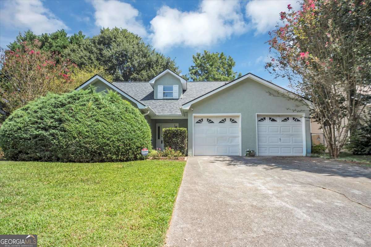 Beautifully Renovated Home in Prime East Cobb Location! Conveniently located near shops, restaurants, Kennesaw State University, and outlet malls, this charming home offers both comfort and convenience. Situated in a quiet, established neighborhood, the home features a sought-after floor plan with the primary suite on the main level. An additional bedroom and full bath are also on the main level. Upstairs, you'll find a third bedroom with its own private bath, along with a versatile bonus room perfect as a 4th bedroom, office, or media space. The updated kitchen boasts granite countertops, and all appliances remain. Enjoy cozy evenings by the fireplace in the inviting living area. Step outside to a fully enclosed patio overlooking a private, fenced backyard-ideal for relaxing or entertaining. Major updates include a new roof, new HVAC system, and new water heater. No carpet throughout for easy maintenance. Move-in ready and a must-see!