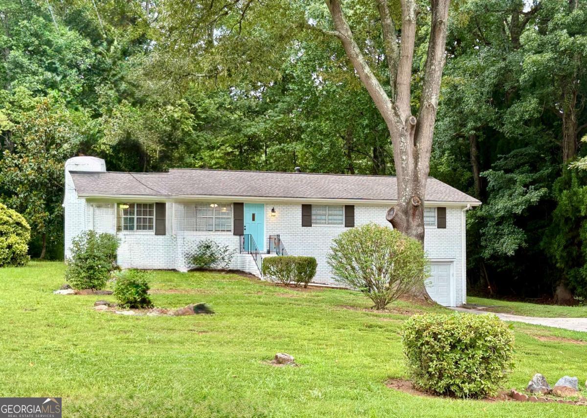 This is the one you've been waiting for-an updated, move-in-ready all-brick ranch on a full, unfinished basement, perfectly blending charm, value, and location. Inside, you'll find thoughtfully curated finishes including board and batten accent walls, a cozy custom window seat with built-in storage, new flooring throughout, and fresh paint inside and out. The home also features an architectural roof for long-lasting durability. Nestled in an established, affordable community with **no HOA**, this home offers unbeatable access to vibrant downtown Woodstock. Even better-a new trail connects the neighborhood directly to the scenic Noonday Creek Trail, making it an easy stroll or bike ride to enjoy downtown's pubs, restaurants, live music, shopping, dog parks, and more. Don't miss your chance to own a stylish home in a fast-growing area with so much to offer-schedule your showing today!