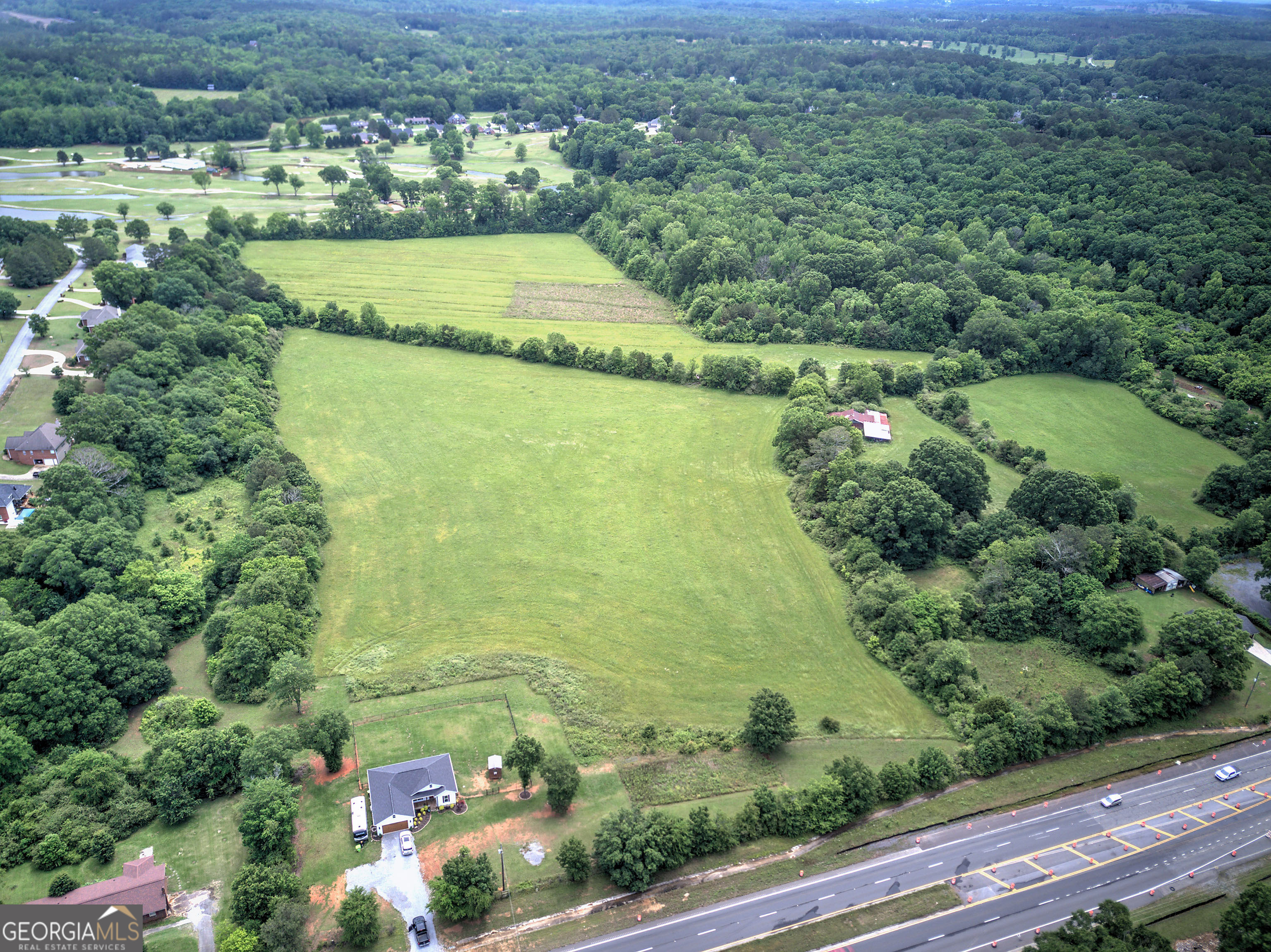 50.37 Acres-Barn, Utilities, Prime Corridor | 0 Rome Hwy, Cedartown, GA | $365,000 (~$7,246/acre) Opportunity meets vision on this sweeping 50.37-acre residential/agricultural tract fronting Rome Hwy (US-27). Minutes to downtown Cedartown and roughly an hour to both Atlanta and Chattanooga, the location delivers rare access to two major job markets while keeping you in quiet countryside. Utilities are already available and a sturdy barn is in place, letting you move quickly-build, farm, subdivide, or hold with confidence. The land is largely open and gently rolling, ideal for homesites, equestrian use, row crops, or a mixed-purpose plan. Zoning supports both residential and agricultural paths, giving investors and homesteaders true flexibility: create a private estate or legacy family compound, carve out residential lots, or launch agricultural operations right away. With increasing demand along the US-27 corridor, this is a smart, supply-constrained buy at just $365,000-beautiful, buildable, and strategically positioned between two growth hubs. The future is wide open-come see how easily your plans can take root at 0 Rome Hwy.