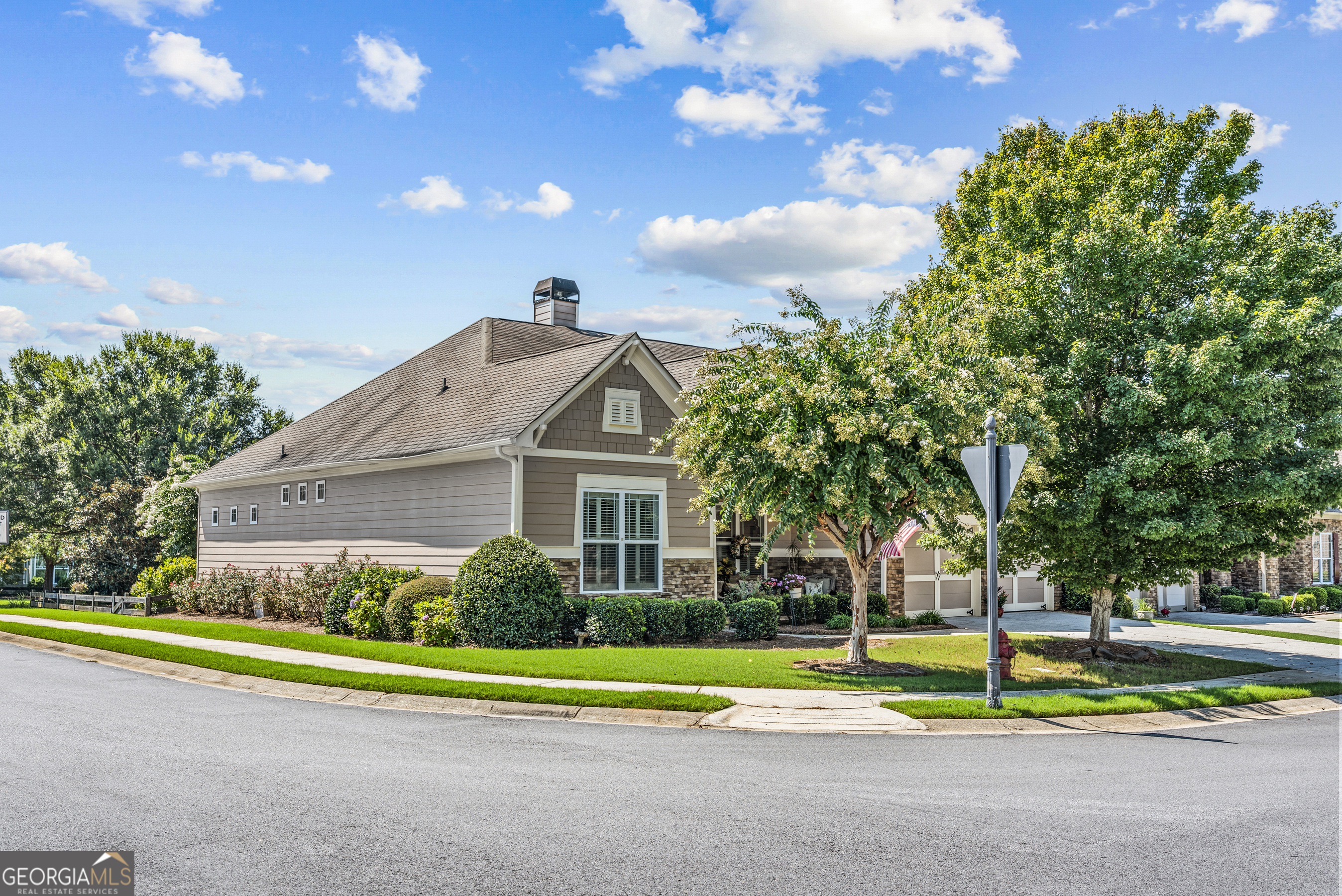 Meticulously kept ranch style home on a corner lot. Beautiful custom built home with hardwood floors. Great room with gas logs fireplace. Kitchen with granite counters/breakfast bar/refrigerator/dishwasher/range/microwave/breakfast area/walkin pantry. Keeping room with gas logs fireplace and built in cabinets. Master bedroom with trey ceiling/carpet/bathroom with large shower/2vanities/large walk in closet. Guest bedroom with a full bathroom. Formal dining room with trey ceiling. Large laundry room with mop sink/cabinets/front loading washer & dryer. 2 Car attached garage with electric openers. Covered from porch plus back yard patio with fenced back yard that is professionally landscaped. Some furniture is available separately. Gated community with clubhouse/swimming pool/tennis courts/gym/playground.