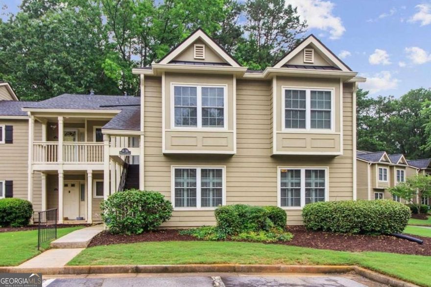 Beautiful and pristine main-level end unit - the largest two-bedroom floor plan available! The spacious living room features a cozy fireplace and flows seamlessly into a separate formal dining room and screened-in porch. The kitchen is equipped with granite countertops, stainless appliances, a convenient breakfast bar, an abundance of cabinets with slide-out shelves in all lower cabinets for added functionality, and a walk-in pantry. The primary suite offers his-and-hers closets and a large ensuite bath with gorgeous quartz vanity and an oversized stall shower. The secondary bedroom is perfect for guests or a home office. The guest bathroom is beautifully updated. Additional highlights include updated light fixtures, ceiling fans throughout, custom shutters, and a private screened patio for relaxing outdoors. Well-maintained! Great storage! Community amenities include a sparkling pool, tennis courts, and a beautiful lake - Elevated everyday living at its best!