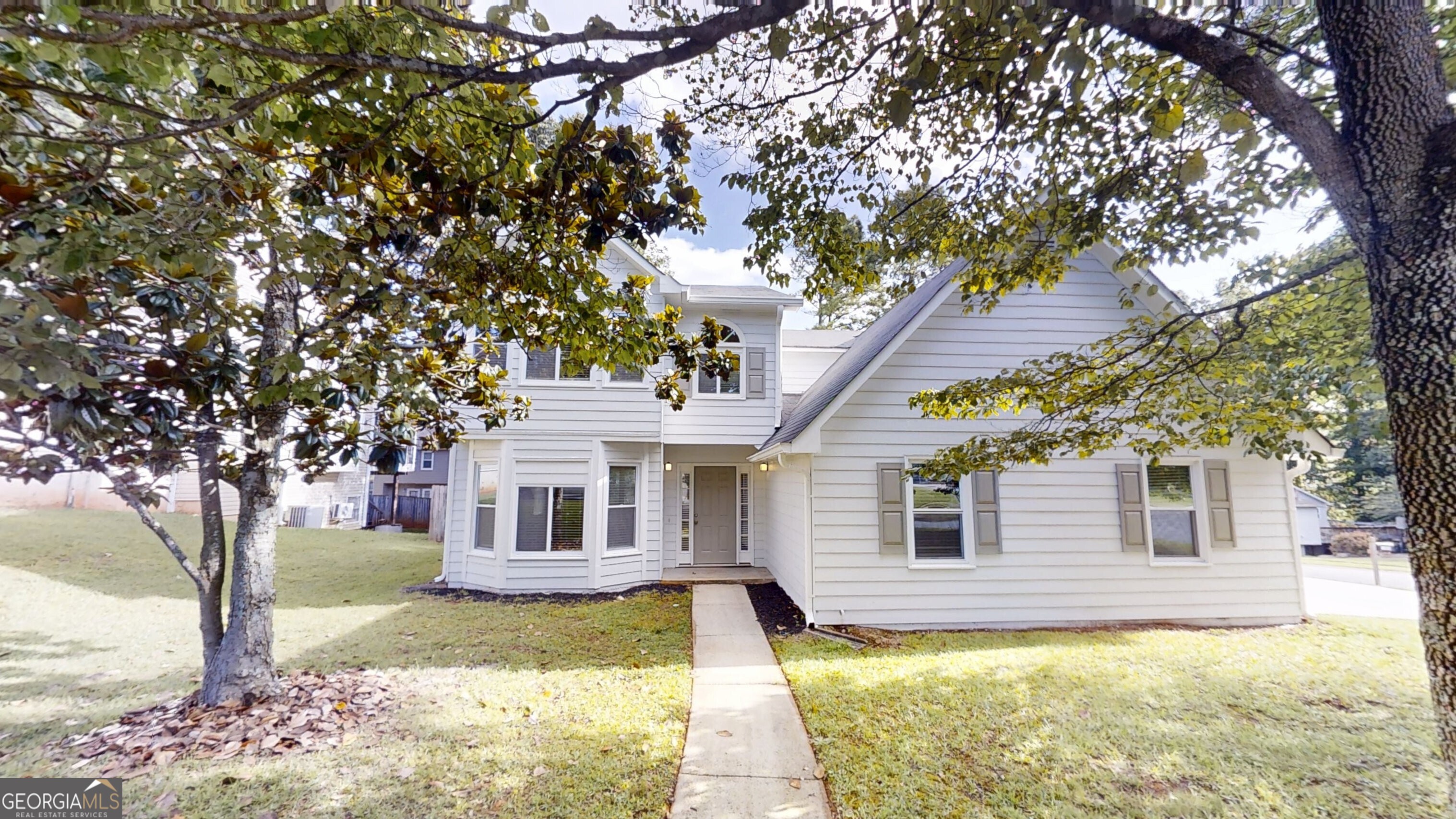 Welcome to this beautifully updated 3-bedroom, 2.5-bath home in the sought-after Hamby Place community! Featuring fresh paint throughout and durable LVP flooring on the main level and in bathrooms, this home offers both style and functionality. Upstairs, you'll find plush carpeting in all bedrooms for added comfort. The cozy family room includes a charming fireplace, perfect for relaxing evenings. The kitchen is a standout with crisp white cabinets, sleek stone countertops, and stainless steel appliances ideal for both everyday living and entertaining. Enjoy a spacious primary suite with a large bath, plus a private rear patio and fully fenced backyard that's perfect for gatherings, pets, or play. Located just minutes from the Peach Pass on/off ramp of I-75, this home offers unbeatable access to commuting, shopping, dining, and more. Don't miss your chance to call this move-in-ready gem home!