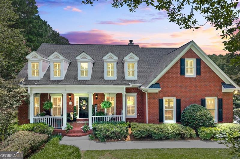This home is an absolute must-see. Custom-built and beautifully maintained, this 5-bedroom, 4.5-bath brick home is located on a quiet cul-de-sac street and features a new architectural roof, manicured landscaping, and black wrought iron fencing enclosing a spacious level lot. Inside, the renovated kitchen is filled with natural light and showcases white cabinetry, quartz countertops, and top-of-the-line stainless steel appliances. The formal dining room comfortably seats 10 or more guests, and a private main-level office offers dedicated workspace. The primary suite is located on the main level, complete with a sitting area and a well-appointed en-suite bath. Upstairs, you'll find three generously sized bedrooms and two full bathrooms. The finished terrace level includes a private entry, private patio, separate living room, bedroom with full bath, and a full sized kitchen/bar area-making it ideal for a guest suite, in-law suite, or multi-generational living. Additional highlights include custom plantation shutters throughout, 9-foot ceilings with detailed crown molding, a lake-fed irrigation system, and a long driveway with parking for five or more vehicles. The private HOA-owned lake offers opportunities perfect for fishing, kayaking, or small boats. Showings to start Saturday, August 2!!!!