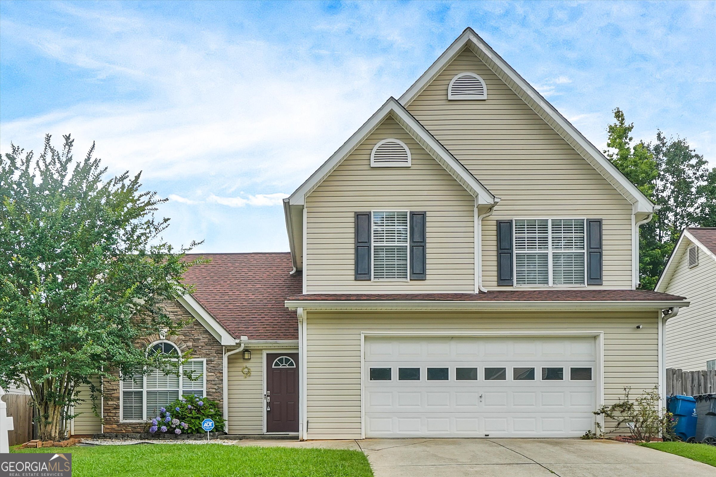Don't miss this incredible opportunity to own a home in the highly desirable Winnsong Chase subdivision-known for its charming atmosphere, welcoming community, and convenient location. This spacious and inviting home features an open floor plan with soaring ceilings in the living room, creating a bright and airy ambiance. The modern kitchen, complete with ample counter space and updated appliances, opens seamlessly to the living and dining areas-perfect for entertaining or everyday living. The main level includes a bedroom and full bathroom, ideal for guests, multigenerational living, or a private office. Upstairs, you'll find three generously sized bedrooms and two full bathrooms, providing space and flexibility for any lifestyle. The primary suite is a true retreat, featuring abundant natural light, a large walk-in closet, and a luxurious en-suite bathroom with dual sinks, a soaking tub, and a separate shower-perfect for unwinding at the end of the day. Situated in a prime location, this home offers easy access to top-rated schools, shopping, dining, and major highways. Experience the perfect blend of comfort, style, and convenience in one of the area's most coveted neighborhoods. Schedule your private tour today and make this exceptional home yours!