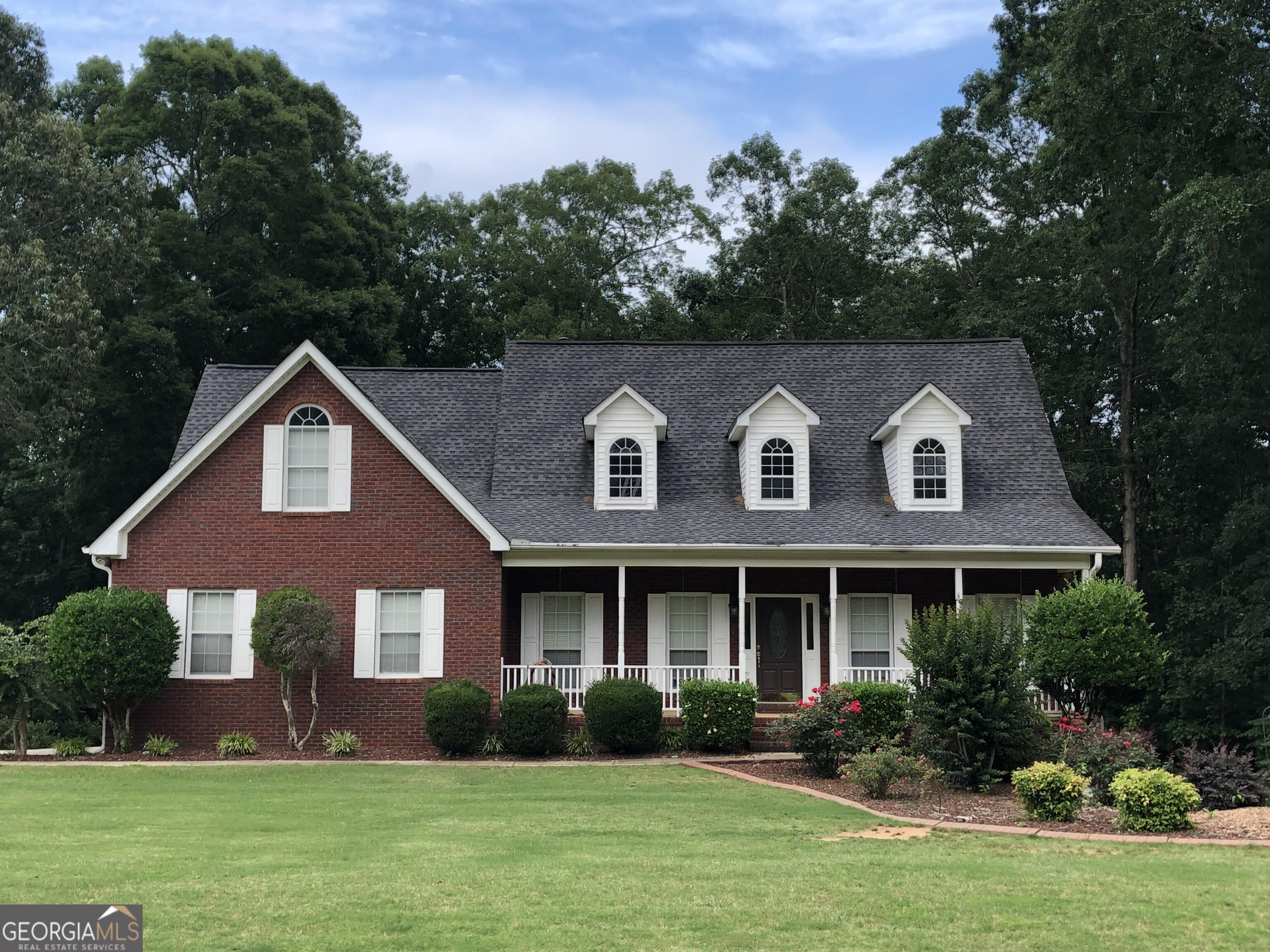 Located in the sought-after Joyner Estates neighborhood within the Ola School District, this beautiful home offers the perfect blend of style, space, and convenience. Don't miss your chance to get in before the new school year starts! Welcome to this stunning home that blends style, space, and comfort! Step through the welcoming two-story foyer into an open-concept layout designed for everyday functionality and entertaining ease. Offering 4 bedrooms, 3.5 bathrooms, and a versatile bonus room, this home has room for everyone. The main level features durable LVP flooring throughout, a formal dining room for special occasions, and a convenient primary suite on the main for added privacy and ease. The kitchen is a chef's dream, complete with granite countertops, a breakfast bar island, and a nice breakfast area surrounded by windows. It opens seamlessly into the living room, showcasing a vaulted ceiling and gas fireplace - an inviting space to unwind or host guests. Step outside to a screened porch that leads to an expansive deck, perfect for enjoying the private, wooded 0.80-acre lot. The level backyard offers endless opportunities for outdoor entertaining, play, or simply enjoying the peaceful setting. The full finished basement adds exceptional living space, including a large den, office, flex room, additional bedroom and full bath, and a workshop with boat door - plus plenty of storage throughout. This home has it all: generous space, thoughtful updates, and a location that offers both tranquility and convenience. Truly move-in ready - come make it your own! Schedule your showing today and make this dream home yours before school starts. Conveniently located near shopping, restaurants, and the Georgia National Golf Course, you'll have everything you need just minutes away. Ask how you can receive up to $1500 credit by using one of our preferred lenders. Exclusions may apply.