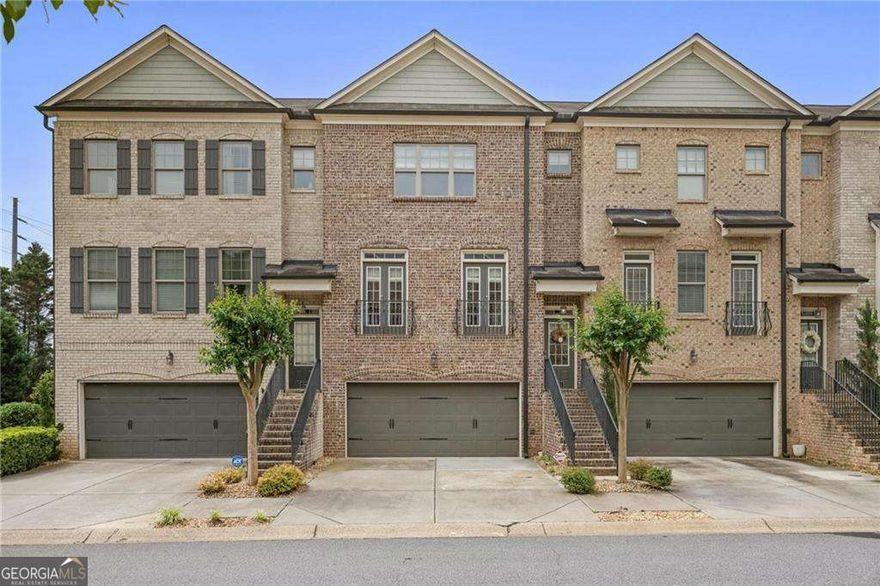 Discover luxury and convenience in this upscale, 4-sides brick, 3-level townhome, perfectly situated just 2 miles from I-75 and a mere 4 miles to the charming Historic Marietta Square! This residence offers an abundance of stylish design elements that will captivate your senses. Step inside to an inviting open floor plan highlighted by gleaming hardwood floors throughout and elegant wood stairs adorned with iron balusters. The custom trim and crown molding add a touch of sophistication throughout. The kitchen is a chef's delight, featuring raised panel wood cabinetry with granite countertops and sleek stainless appliances. Relax in the fireside family room or entertain in the formal dining area. Retreat to the stunning vaulted master suite, a true haven, complemented by tile baths and a convenient laundry setup. With two bedrooms upstairs and one on the lower level with garage entry, every bedroom is an ensuite, providing privacy and comfort for all. This home also boasts modern upgrades, including a brand new HVAC system with new furnace and outdoor condenser, as well as a brand new water heater, ensuring year-round comfort and efficiency. Don't miss the opportunity to call this beautiful property your home, where style meets convenience in a sought-after location!
