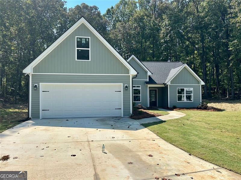 NO HOA! Conveniently located just off GA Hwy 60 on peaceful Bird Rd in desirable North Hall, this stunning Kristen floor plan offers the ease of step-less ranch living with all bedrooms and bathrooms on the main level, plus a finished bonus room upstairs for a fourth bedroom or flexible space. The open-concept design features granite countertops and durable LVP flooring throughout the living and kitchen areas, combining style with low-maintenance living. Enjoy quiet mornings or relaxing evenings on your private, covered back patio. With its prime location, you're just 10 minutes from both Gainesville and Dahlonega, and only a short drive to Dawsonville. Affordable living in a brand-new home - don't miss this opportunity!