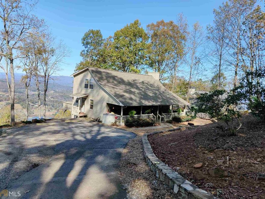 A cut above the rest on Ramey Mountain is the 2 bedroom and 2 bathroom with open loft.  Views of Lake Chatuge and long range mountain. Vaulted ceiling, hardwood floors, fireplace with top of the line gas logs and rated as additional heat source. Kitchen and bathrooms completely remodeled. Beautiful Hardwood Flooring. Form encapsulation crawl space with 10 ft tall plat form and tons of storage, radon system installed, new shed and siding. This home is full of charm,  beautifully maintained and less than a mile to lake, marina, movie theaters and restaurants. Additional lot available for 59K cleared, perked and building permit. Ready to go. Get both!