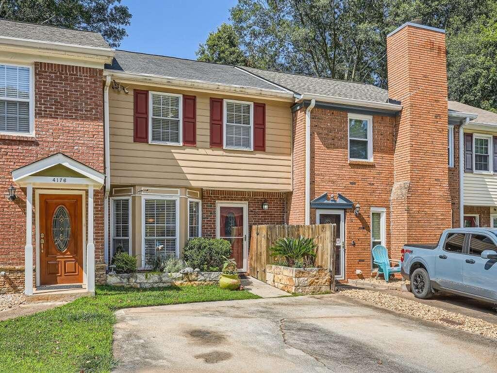 RUN..Don't Walk to this Incredible Townhome in the City of Tucker! This 2-story wonder has a renovated kitchen, all new bathrooms, new hardwoods and more! 2 large bedrooms & 2 1/2 bathrooms (yes, a guest 1/2 bath downstairs!) make this a dream for anyone! Located on a private cul-de-sac with no HOA (yay!), it's tucked in to a wooded area for maximum privacy. Beautiful landscaping greets you as you step up to this sweet home. The bright new eat-in kitchen overlooks the large family room with fireplace. Homeowners recently added a separate office area & storage closet off of the family room for even more space! Head out back to very private back deck overlooking the recently added astroturf fenced in yard with special drainage too! Perfect for your furry friends or human ones! Upstairs, you'll find a large guest suite with its own new private bathroom. Separate Laundry closet w/ storage located in hallway. Primary suite has 2 large closets, plenty of space & a sleek new bathroom. New HVAC, New Roof, New Hot Water Heater. This home is about as "move in ready" as it gets! Convenient to Tucker Middle School (just around the corner) & all of the wonderful Tucker public schools! Amazing location, right off of Fellowship, super close to Lawrenceville Hwy for easy access to 285.