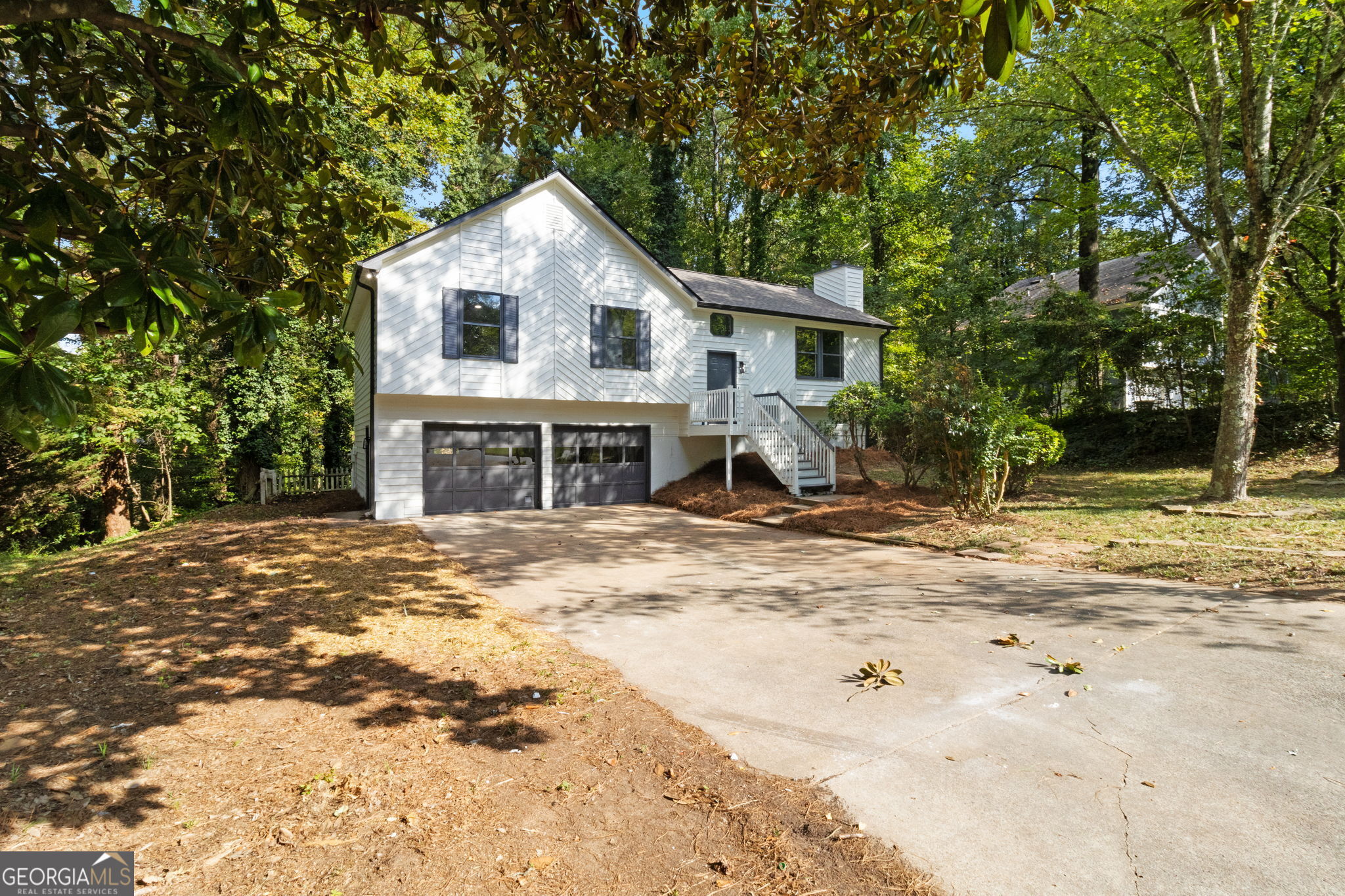 Stunningly renovated 4 bed/3 bath home with two Master Bedrooms/In-Law suite in the basement featuring brand new Luxury Vinyl Plank flooring, brand new 30-yr Architectural Roof, new interior and exterior paint, new lighting and plumbing fixtures everywhere, new granite countertops in kitchen and bathrooms, and new stainless-steel appliances. Home offers beautiful curb appeal with a 2-car garage. Enter into the large open floorplan living room offering large windows to allow in lots of natural lighting, fireplace, and views to the kitchen. Kitchen offers new granite, new cabinets, plenty of cabinets and countertops space, huge island with overhang perfect for barstools, stainless steel appliances, and large eat-in dining area. Main level Master bedroom offers an En-suite with walk in shower, new granite, and low flow toilet. Two good sized secondary bedrooms and secondary bathroom upstairs with tub/shower combo, low flow toilet, and new granite. The basement offers a large second Master bedroom/In-Law suite and En-suite with double vanity, low flow toilet, and walk in shower. Out back the deck and patio overlook the fenced in backyard.