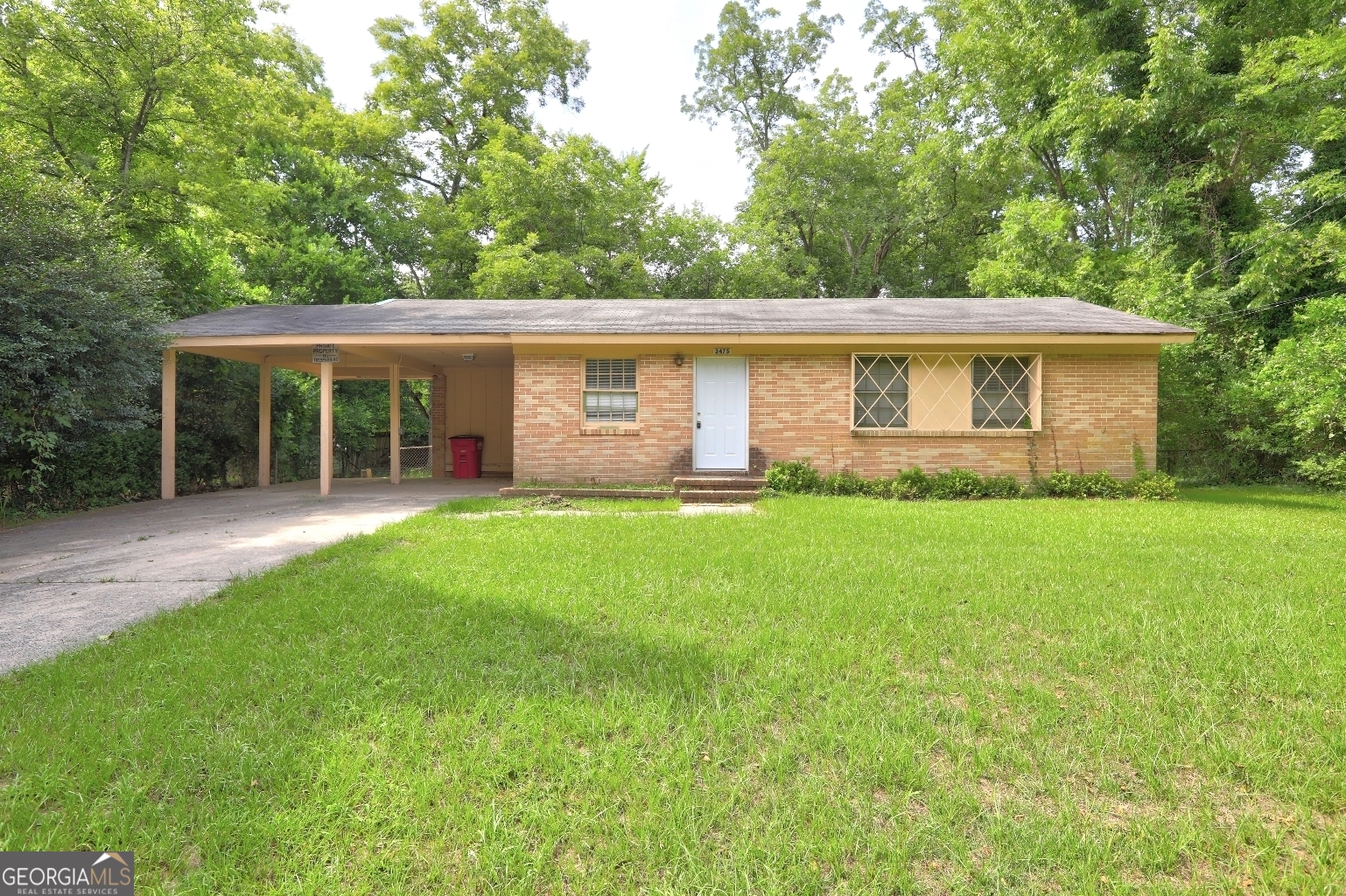 Don't Miss This 3 Bedroom, Brick Home in Great Macon Location! Hardwood Floors, Large Backyard and Easy Access to Interstate and Shopping. 2 Car Carport.