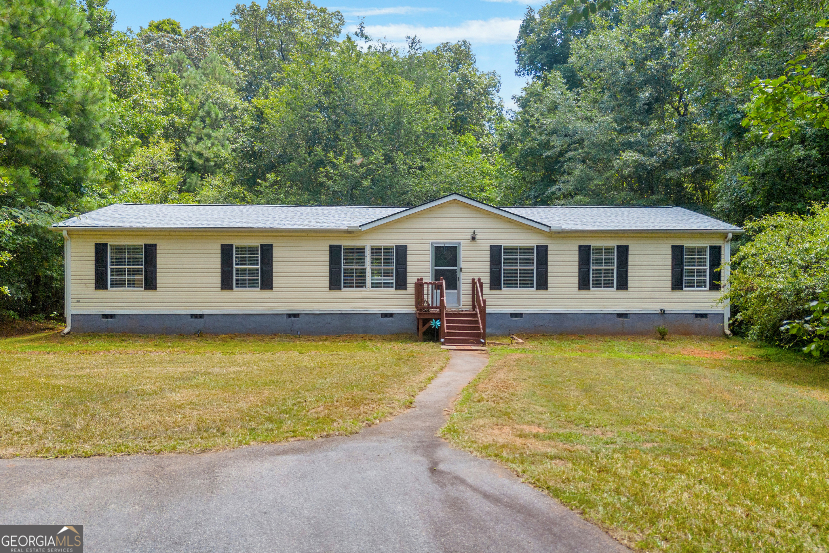 Discover your slice of paradise in this beautifully upgraded mobile home nestled in a serene cul-de-sac. Set on a generous 2.8-acre private lot, this 3-bedroom, 2-bath retreat combines modern comfort with the tranquility of nature. Step inside to find a bright and inviting living space, perfect for family gatherings or cozy evenings in. The well-appointed kitchen boasts contemporary upgrades, making meal prep a delight flowing into the Great Room with fireplace. Each of the three bedrooms offers ample space, ensuring everyone enjoys their own private sanctuary. Split bedroom plan. Large Primary Bedroom with ensuite featuring soaking tub and separate shower. Outside, your expansive lot awaits! Imagine endless possibilities for outdoor activities, gardening, or simply unwinding amidst nature's beauty. With room to roam and privacy to spare, this home truly offers a unique lifestyle opportunity. Don't miss out on this rare gem-schedule your private tour today and embrace the peaceful life you've always dreamed of! Professional pictures coming soon. Mobile home title has been retired.
