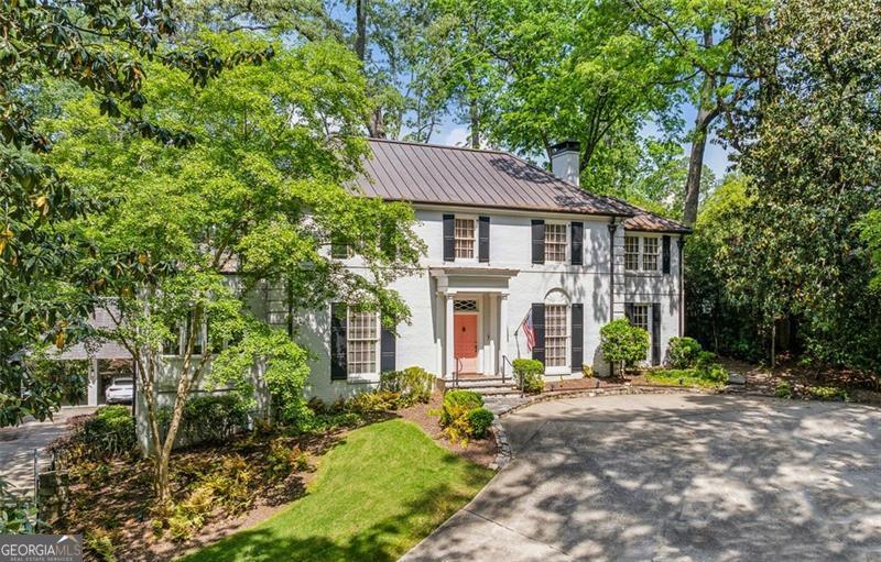 Experience timeless sophistication in the heart of Buckhead with this impeccably designed estate, privately set on 1.3 acres of manicured grounds. This remarkable residence showcases 4 spacious bedrooms, 4 full baths, and 2 half baths, each adorned with refined finishes, custom archways, and exquisite wall coverings that add depth and character throughout. A welcoming entry foyer opens to a gracious formal living room and a richly appointed home office tailored for today's lifestyle. The gourmet kitchen serves as the home's centerpiece, crafted for both culinary artistry and effortless entertaining, while an adjoining sitting room invites relaxed gatherings. The owner's retreat is a true sanctuary, complete with a spa-inspired bath and an intimate reading porch. The finished terrace level enhances flexibility with space for a media lounge, playroom, or private gym. Step outdoors to a resort-style setting with landscaped grounds, a sparkling pool, and a pool house designed for ultimate entertaining. Complete with a fireside patio, kitchen, living room, sauna, and full bath, it offers the perfect backdrop for gatherings both large and small. Seamlessly blending classic elegance with modern luxury, this Buckhead masterpiece offers an unparalleled lifestyle of comfort, privacy, and distinction.