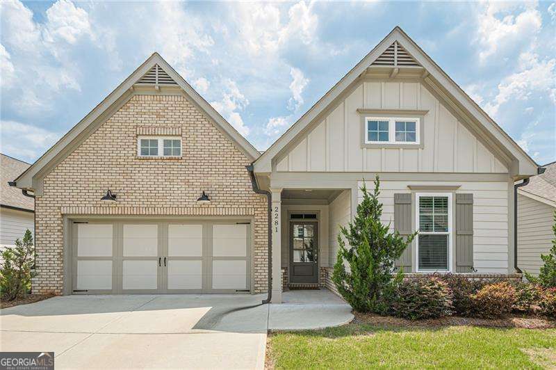 Perfectly maintained 4-year-old home in this 55+ Active Adult gated community with dog park and garden. This home features a two-story foyer with floors leading to the open kitchen, dining area and vaulted great room with fireplace. Prepare those gourmet meals in this well-appointed kitchen which includes stainless steel appliances, double oven, gas cooking, breakfast bar, and granite countertops. Access the covered patio and fenced back yard for an evening of relaxation. The spacious owner's suite offers trey ceilings, double vanity, separate water closet, grand shower and huge double-sided closet. The property also features a second bedroom and bath on the main level and a third bedroom and bath on the upper level. There is additional unfinished space upstairs for expansion. 2-car garage. Once you see it, you'll want to make it your HOME!