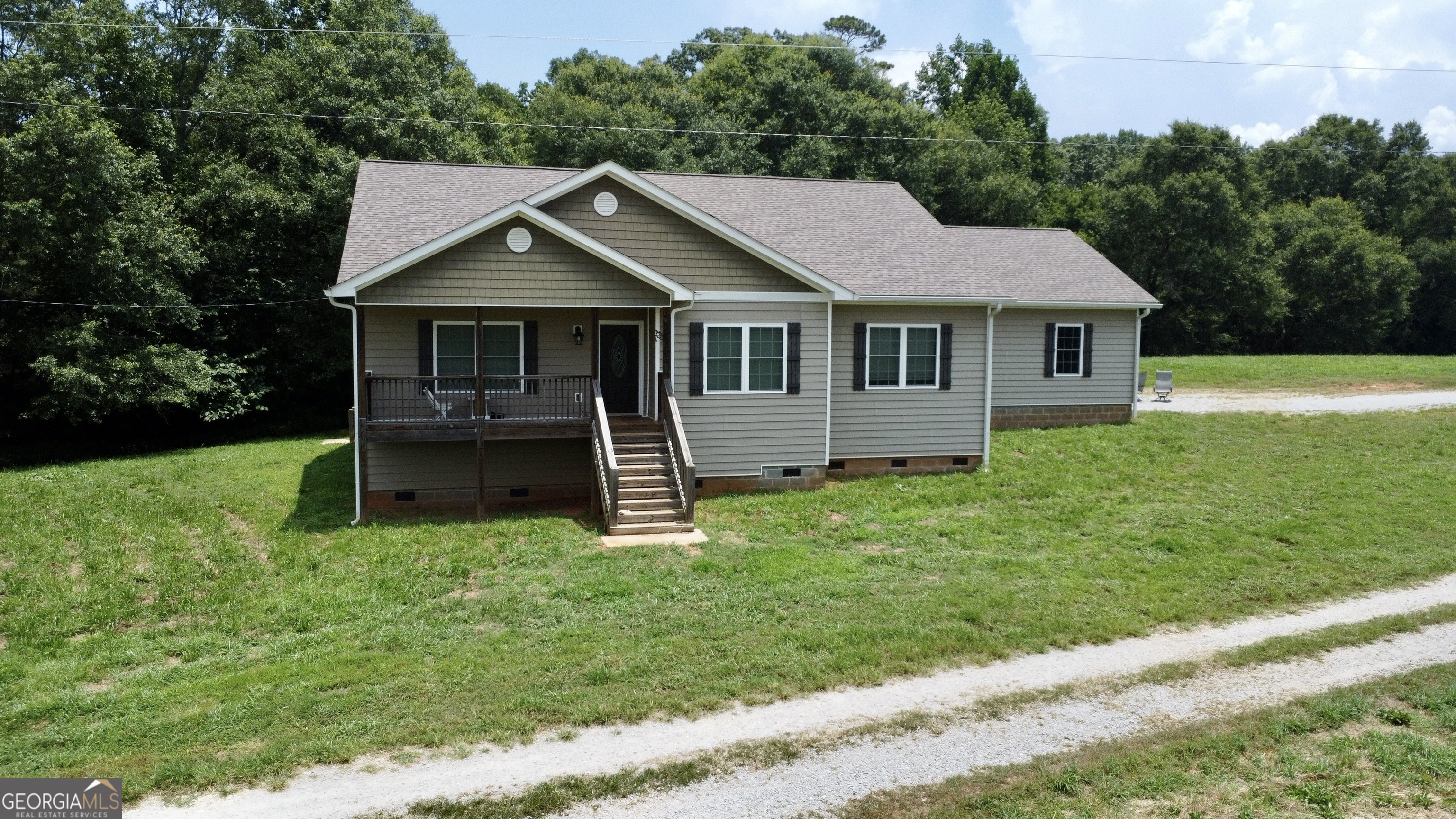 Modern 4BR/3BA Home on 4.5 Acres - Bowdon, GA Built in 2022, this beautiful 4-bedroom, 3-bath home sits on 4.5 acres just outside of downtown Bowdon. With a spacious open yard, modern finishes, and a peaceful rural setting, this property offers the perfect blend of comfort, convenience, and privacy. The home features approximately 2,100 square feet of well-designed living space with an open layout, stylish kitchen, and up-to-date fixtures throughout. Enjoy the quiet surroundings and room to spread out, while being less than 5 minutes from town, 20 minutes to Carrollton, and under an hour from Atlanta. Whether you're looking for a peaceful homestead, a family home with acreage, or a modern retreat in the country, this one checks all the boxes. Additional acreage available.