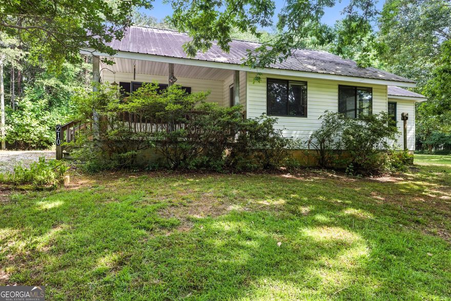 blend of convenience and privacy in this charming 3-bedroom, 2-bath home located in the heart of Demorest, just a short walk to Piedmont University. Tucked away on a quiet back street, this property offers easy access to both Hwy 441 and Hwy 365 while maintaining a peaceful, tucked-away feel. The large side yard provides plenty of space for outdoor activities, gardening, or simply relaxing in the fresh air. A versatile pole-barn style workshop or carport sits beside the home, ideal for storage, hobbies, or covered parking. Whether you're seeking a comfortable primary residence or an investment in a prime location, this property checks all the boxes.