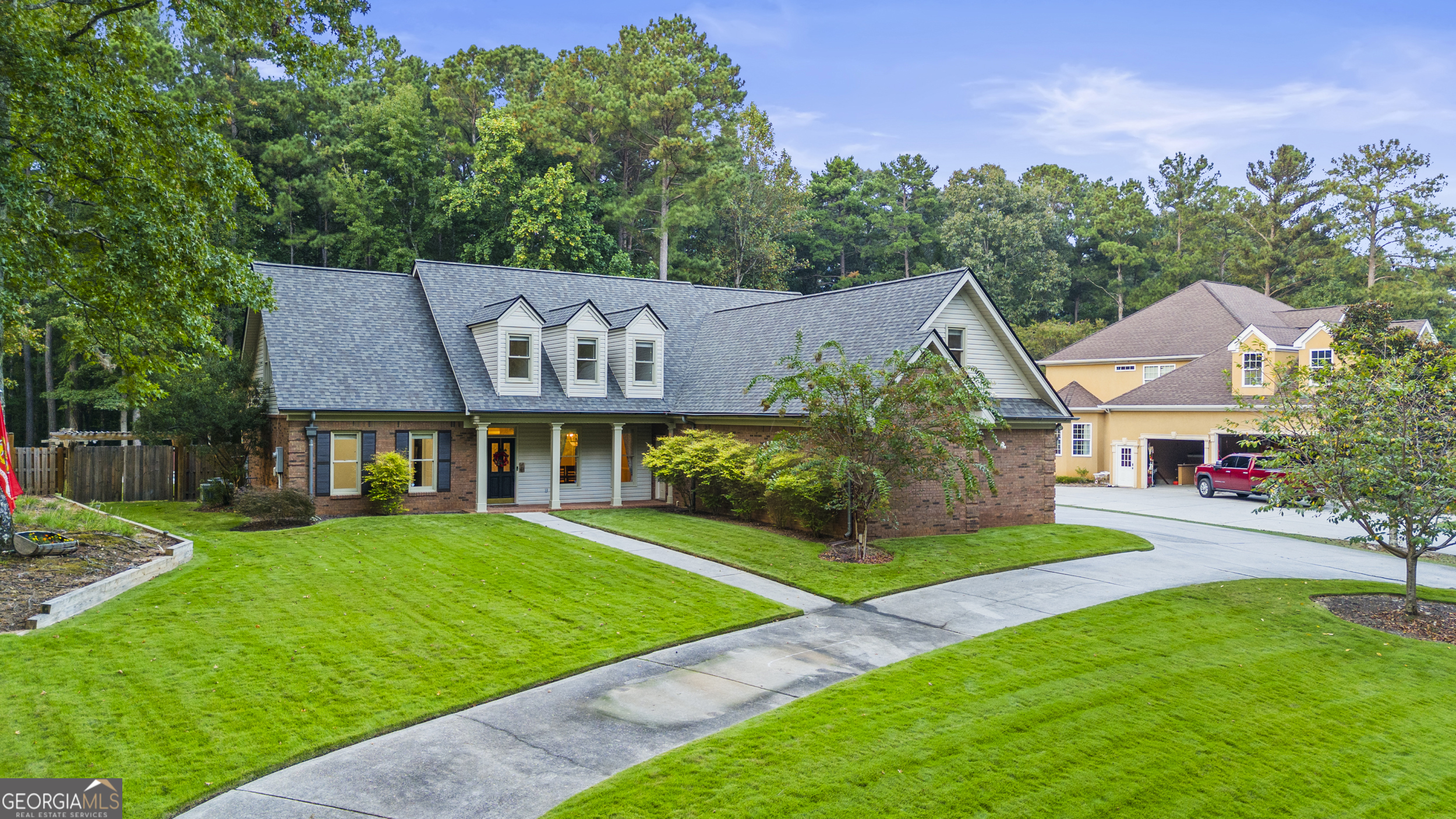 Welcome to this stunning 4-sided brick home in Fayetteville, complete with a sparkling pool. Situated on a circle driveway, this home combines timeless charm with everyday convenience. Step inside from the inviting front porch and be welcomed by a formal dining room and a spacious living room with a cozy fireplace and a wall of windows showcasing views of your private pool. Just off the kitchen, a sunroom provides the perfect second living area or casual gathering spot. The kitchen is a chef's delight with an island, bar seating, and abundant cabinetry. The main-level primary suite features tray ceilings and a spa-like bathroom with dual sinks, a makeup counter, soaking tub, stand-up shower, and a generous walk-in closet. A split bedroom layout offers two additional bedrooms on the main floor sharing a full bath. Upstairs, you'll find a huge loft area, two more bedrooms, another full bathroom, and a versatile bonus room, ideal for a home office, gym, or playroom. Enjoy outdoor living in the large backyard with a covered patio overlooking the pool. The property is enhanced with a brand-new fence featuring a gate and RV parking pad, plus recent upgrades including a new roof, new pool pump, and new water heater. This home is move-in ready with all the extras - schedule your private tour today! Southeast Mortgage is our preferred lender. If buyer chooses to work with them, Southeast Mortgage will provide 1% credit up to $5,000. Reach out to the listing agent for more information.