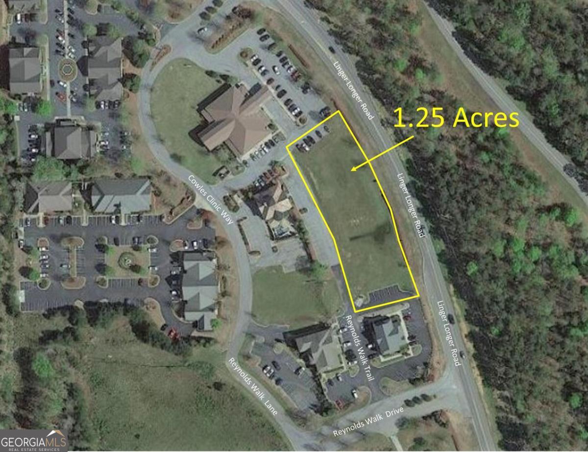 PRIME COMMERCIAL PROPERTY LOCATED on Linger Longer Road near the entrance to Reynolds Lake Oconee and the Ritz Carlton. MINUTES TO PUBLIX SHOPPING CENTER, GOLF COURSES, RITZ CARLTON RESORT, & ST MARY'S HOSPITAL. Some restrictions apply. The listing agent has a material relationship with the seller. POA Fees and Real Estate Taxes are estimated. Real estate, banking type businesses, and medical type businesses are restricted. Reynolds Walk Covenants attached.