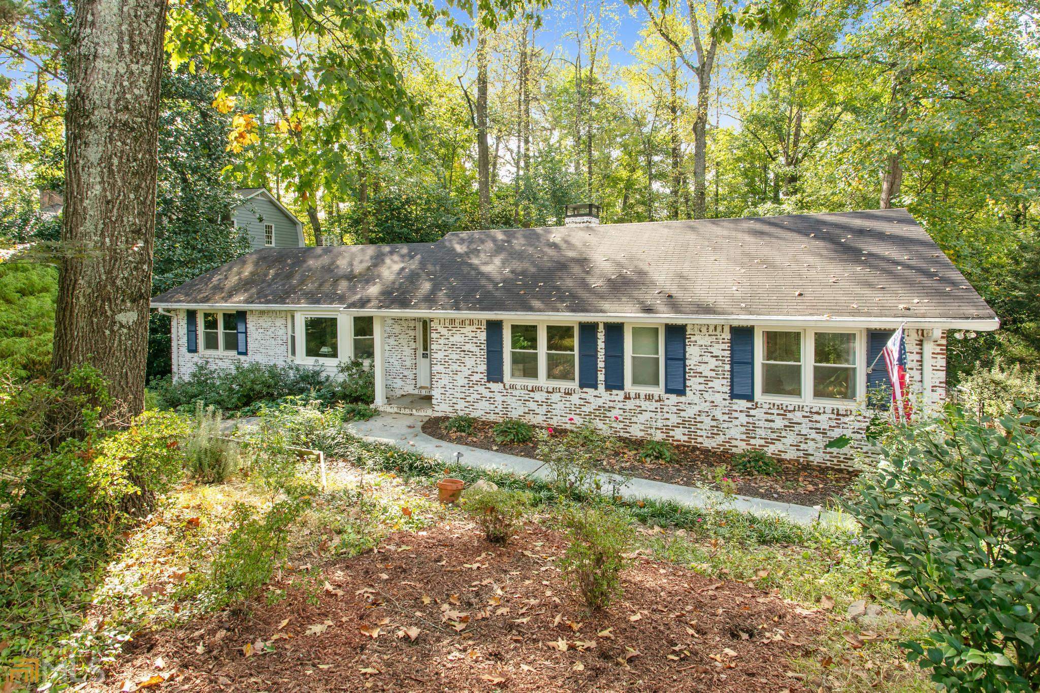 A home that embraces the best of present and past! This home is on a quiet road, in a diverse neighborhood with a growing sense of community. The large fenced backyard allows for outdoor activities for your pets and kids. It's also 1/2 acre so you don't have to worry about traffic. Gleaming hardwood floors throughout, a gas fireplace in the living room, new heating and air conditioning system, new no clog gutters, and a 2 car garage. The open concept kitchen leading into the dining room and living room area is perfect for entertaining! Modern windows provide natural light and picturesque views of the trees outside! Easy access to major highways, dining and shopping just minutes away.