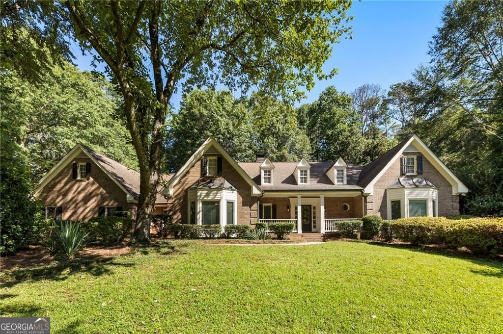 Incredible Opportunity to Own a Stunning 3+ Acre Hobby Farm in Milton! Nestled in a prime location with easy access to everything Milton has to offer, this picturesque property provides the perfect blend of country charm and modern convenience. Situated on over 3 acres of serene land, this home offers comfortable one-level living, with additional space upstairs and a finished terrace level for ultimate flexibility. As you step onto the front porch and into the inviting foyer, you're greeted by an open, airy great room featuring a beautiful coffered ceiling, a cozy masonry fireplace, and a sun-drenched, vaulted wood-paneled sunroom perfect for a home office. This home exudes warmth and character at every turn. The kitchen features floor-to-ceiling cabinetry, granite countertops, a large center island, and a timeless subway tile backsplash. High-end Dacor appliances elevate the space, while a sunny breakfast room with a charming bay window offers the perfect spot to start your day or unwind after a busy one. The kitchen flows effortlessly to the pool area, making entertaining a breeze. A newly renovated ceramic-tiled hall leads to a spacious laundry room, pantry, and a generously sized dining room - perfect for hosting family gatherings or dinner parties. The luxurious primary suite, located on the main level, is a true retreat, featuring a recently updated spa-like bath and a massive walk-in closet complete with a professional organizing system. Two additional bedrooms on the main level offer comfort and style, sharing a beautifully renovated Jack-and-Jill bathroom. Upstairs, you'll find a versatile full living suite with a spacious bedroom, a smaller bedroom/office, and a full bath - ideal for guests, a home office, or a private retreat. The terrace level features a newly finished kitchenette, a cozy wood-burning fireplace, a living area, and a billiards space, this level also includes a full bath. Two additional rooms offer unfinished space with a utility sink, plus a boat door and exterior access, giving you ample room to customize or expand. Outside, the 4-board equestrian fencing encircles the entire property, complemented by additional pasture fencing. The 2-stall barn, equipped with water and power, is perfect for horses or other livestock. The stunning pool area features flagstone decking, a tranquil waterfall, and elegant stonework, creating an ideal setting for al fresco dining and relaxation. With award-winning public and private schools nearby, as well as quick access to GA400, Avalon, Halcyon, downtown Alpharetta, and the charming Crabapple district, this is a rare opportunity to own a hobby farm with all the amenities of modern living. Don't miss your chance to experience the perfect balance of luxury, privacy, and country living!