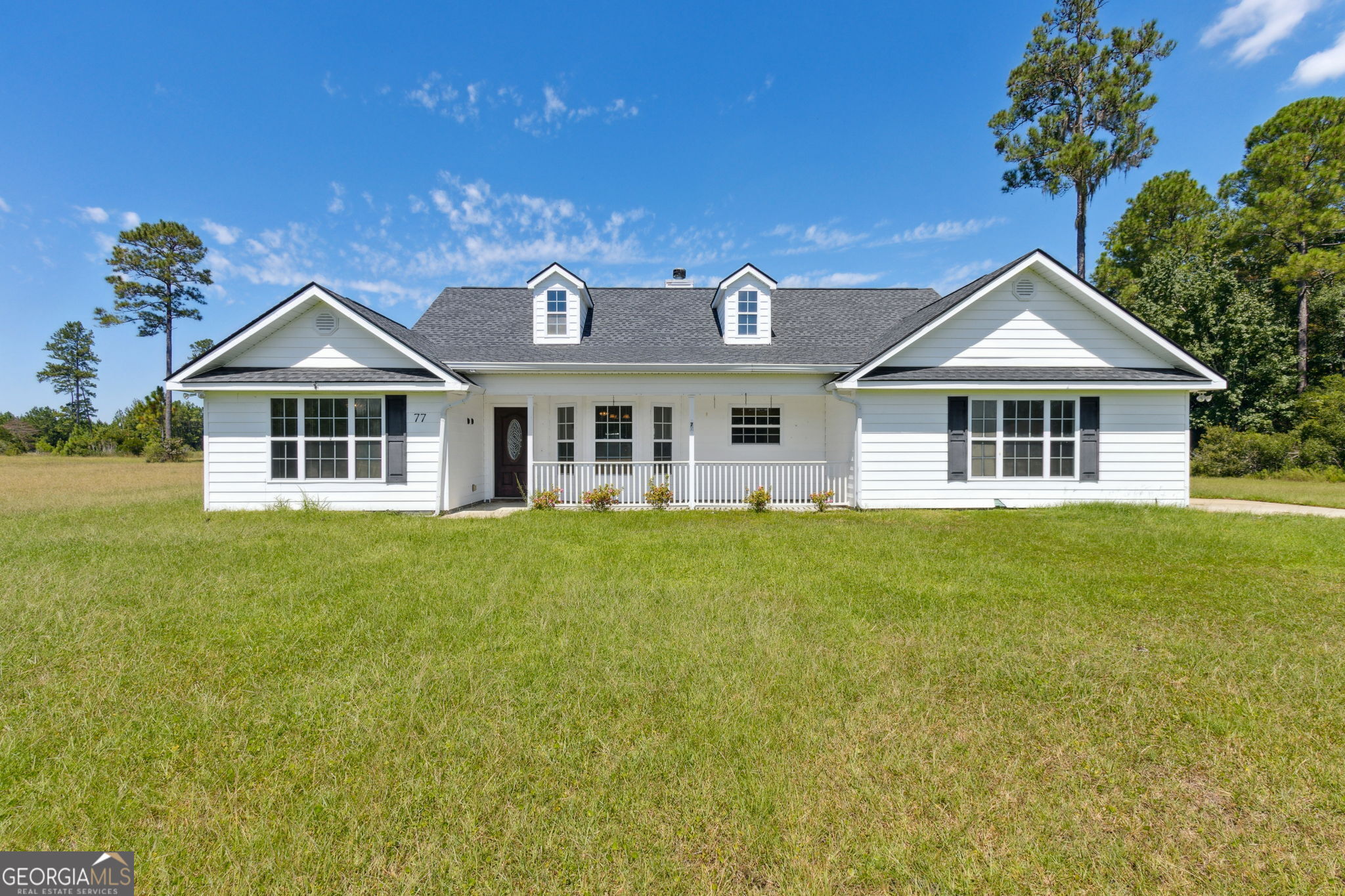 Welcome to your dream country retreat! This beautiful ranch home, built in 2005, is nestled on a picturesque 3.26-acre parcel, with an additional 3.21-acre corner parcel in Wildwood Country Estates, offering over 6 acres of land for gardening, livestock, or simply enjoying the serene countryside. A stunning pond at the rear of the home adds to the charm and provides a perfect spot for relaxation and outdoor activities. As you step inside, you'll be greeted by the warmth of a charming country-style decor. The inviting kitchen boasts lovely wood cabinets and comes fully equipped with all appliances, making meal preparation a delight. Adjacent to the kitchen, the separate dining room is perfect for formal dining. The heart of the home is the spacious family room, featuring a stunning all-brick wood-burning fireplace that adds a cozy touch to your evenings. Built-in storage provides both functionality and charm, keeping your living space organized and clutter-free. This sought-after, split floor plan offers privacy and comfort, with the primary suite thoughtfully situated on one side of the home, while all guest bedrooms and the additional bathroom are located on the opposite side. This layout creates an ideal flow for both everyday living and hosting visitors, with the common areas centrally located for easy access. This home has a NEW ROOF and is being sold "AS IS." Located in beautiful Woodbine, Georgia, this home is conveniently close to Kingsland, St. Mary's, and Brunswick, GA, providing easy access to Schools, shopping, dining, and local attractions. With ample outdoor space to explore and a picturesque pond to enjoy, you have everything you need to embrace the tranquility of country living. Don't miss the opportunity to make this beautiful ranch home your own. Schedule a showing today and start envisioning your life in this idyllic setting!