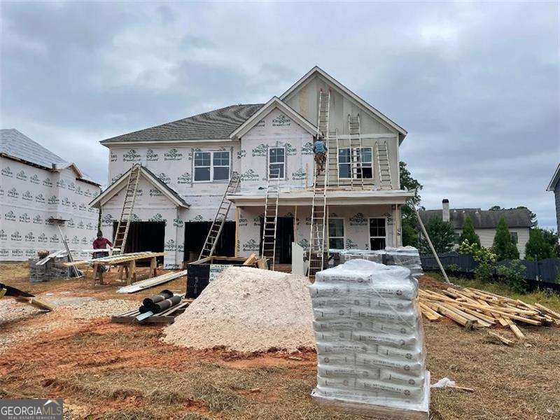 Introducing a brand-new construction in East Cobb! This 5-bedroom, 4-bathroom home also boasts a media room. **Photos are of similar home** Home will be ready in Nov 2025. It's been meticulously crafted with numerous custom upgrades. The grand two-story foyer leads to an elegant formal living and dining room. The kitchen is a highlight, featuring a custom island with white cabinets, a custom vent hood above the cooktop, stylish tile backsplash, quartz countertops, and a stainless steel double oven appliance package. The main level showcases beautiful hardwood floors throughout (except in one bedroom), extending to the stairs. The master suite is a retreat, showcasing, a semi-frameless shower enclosure, and a generously sized walk-in closet. Upstairs, you'll find three more bedrooms, two full baths, and the media room, as well as a convenient laundry space. This home offers an exceptional living experience in East Cobb.