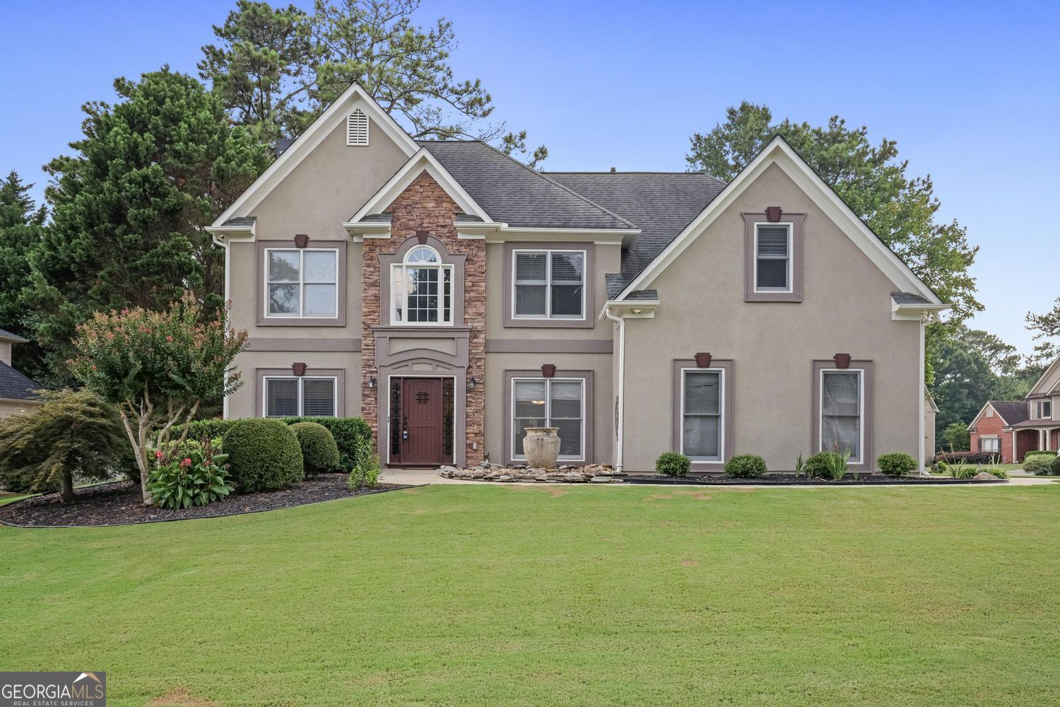 Come see this beautiful 4 bedroom/ 3 bath home located in the quiet, highly sought after Cameron Park subdivision. This home sits on a .3024 acre level, corner lot, and is well landscaped and has a long driveway. Walking into the 2 story foyer home, you will see an office/ flex room to the left and spacious dining room to the right. Further into the home is a 2 story great room with a stone fireplace. There is new flooring in the great room, kitchen, downstairs bedroom and new tile in the full downstairs bathroom. The kitchen opens to the great room, has granite countertops, and stainless appliances. There is a pantry in the eat in kitchen area that leads to the fabulous sun room with windows galore! On the first floor there is also a bedroom, full bath and laundry room. Upstairs are two, spacious, secondary bedrooms and a very spacious owner's suite with a sitting room and tray ceilings. There is new flooring in bedrooms and baths in the upper level. There is also a second laundry upstairs. Additional improvements to the home include new water heater (2024), new paint - interior and exterior (2024/2025), new downstairs AC unit (2019), updating of many of the fans and lighting throughout the house, painted the garage floor (2025), and new fence. Amenities include swimming pool, tennis court, picnic area, and clubhouse. Convenient to I 75, Hwy 41, Marietta Square, Kennesaw Mountain National Park, Kennestone Hospital and Walker School.