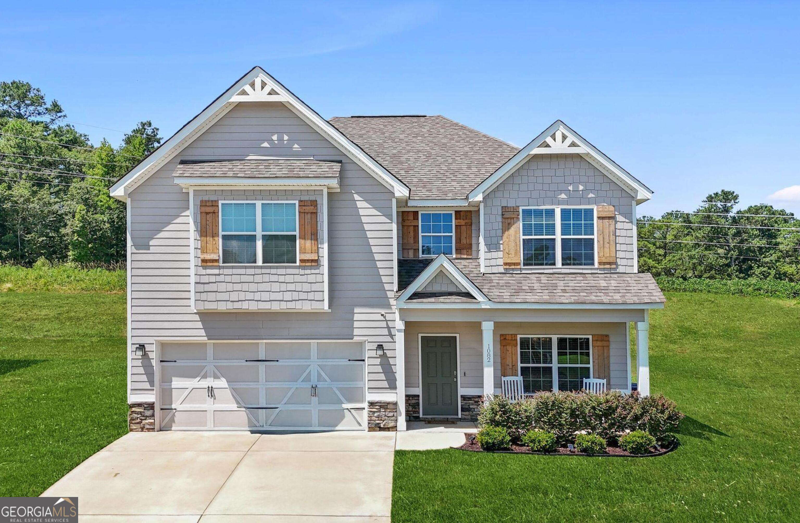 BEST DEAL IN TOWN! MOVE-IN- READY! Welcome to this stunning two-story home featuring a grand foyer, an expansive kitchen, and a spacious owner's suite. This residence showcases the highly sought-after Delilah plan, offered at an exceptional price point! With 4 generously sized bedrooms and 2.5 baths, this home provides all the amenities a new homeowner could desire, all at an incredible value. The open and inviting kitchen boasts stainless steel appliances, elegant pendant lighting, granite countertops, and ample storage and workspace. It seamlessly overlooks the casual dining area and living room, creating the perfect setting for gatherings. The formal dining room is adorned with charming coffered ceilings, adding a touch of sophistication to any meal. Imagine cozy nights by the fireplace with family and friends during the cooler months, whether after dinner or while enjoying a movie night. Upstairs, discover the expansive owner's suite, complete with abundant natural light and a serene relaxation space. The owner's bath features a separate shower, a luxurious garden tub, dual vanities, and an oversized walk-in closet. The additional bedrooms also offer spacious closets, ensuring everyone has plenty of room. This home is equipped with a two-car garage, a convenient mudroom, a covered patio, and so much more! VA assumable mortgage rate of 5.375! Great incentives available!
