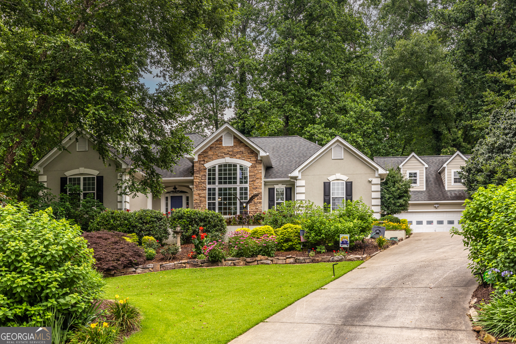 A beautiful mediterranean ranch which was custom built by the owner and lovingly maintained over the years in the sought after Historic College Park area near the Woodward Academy Campus. The grounds are park like and that is no exaggeration at all. The plantings and the Koi pond are very tastefully done. As you enter the home the finishes are definitely well thought out by the owner and his designer. On the main floor you have a foyer, light filled Living room with Stone fireplace, formal dining room, Chef's kitchen w/informal eating area as well as a breakfast bar, laundry room, and the expansive master suite. The master bath is a true delight with a double bowl vanity, soaking tub and separate shower. The closet is a walk in with ample hanging and storage space. also on the main floor we have two guest bedrooms with an adjoining full bath. The full basement is 80% complete with a fourth bedroom, third full bath, game room and family room. Plus there's unfinished storage area. One of my favorite features is the screened porch off the kitchen which is a terrific spot to enjoy that morning coffee or the company of good friends. The two car garage is a stand alone with a large bonus area above the parking. Come see this one, you definitely will not be disappointed.