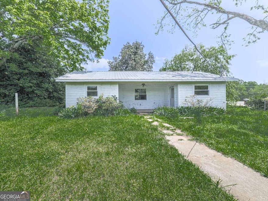 Charming 1-Bedroom Home on 2 Usable Acres with Barn & Outbuildings!Built in 2011, this cozy and well-maintained 1-bedroom, 1-bathroom home offers approximately 1,000 square feet of comfortable living space-all on a beautifully level and usable 2-acre lot. Inside, you'll find a functional layout with a full kitchen, in-home laundry, and bright living areas perfect for everyday living or a weekend retreat. This home could easily be converted to a 2 bedroom!  Step outside to truly appreciate the value of this property: a spacious covered 3-car carport, several versatile outbuildings, and a large barn situated toward the back of the property-ideal for animals, storage, hobbies, or workspace. The lush pastureland offers a peaceful, rural feel while still being just minutes from shopping, dining, and easy highway access.  Whether you're looking for a private retreat, a hobby farm, or a property with space to grow-this one checks all the boxes. Come see the possibilities!