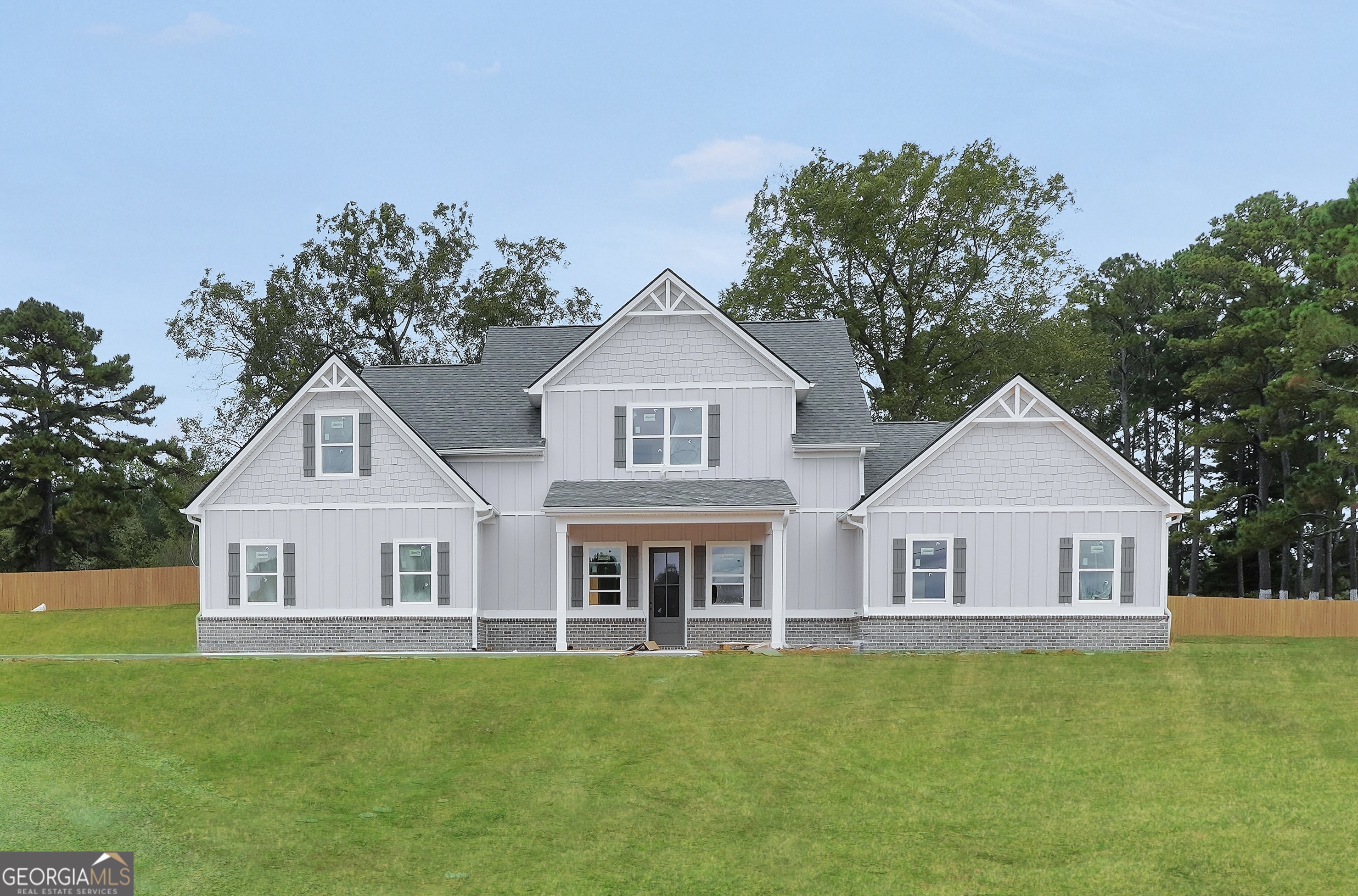 Welcome to this stunning new construction home offering 5 bedrooms and 4.5 baths, perfectly situated on a beautiful 1-acre lot. Thoughtfully designed with modern living in mind, this home features an open-concept layout that seamlessly connects the spacious living area, dining space, and gourmet kitchen-ideal for entertaining or everyday comfort. The primary suite is conveniently located on the main level, providing a private retreat with a luxurious ensuite bath and generous walk-in closet. Upstairs, you'll find additional bedrooms and baths offering plenty of space for family or guests. With high-end finishes, quality craftsmanship, and peaceful surroundings, this home combines elegance and functionality in every detail. Schedule a showing today! The first photo is the actual house, the interior photos are stock photos.