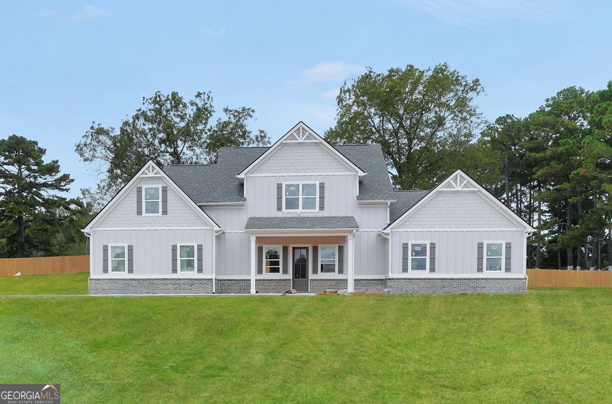 Welcome to this stunning new construction home offering 5 bedrooms and 4.5 baths, perfectly situated on a beautiful 1-acre lot. Thoughtfully designed with modern living in mind, this home features an open-concept layout that seamlessly connects the spacious living area, dining space, and gourmet kitchen-ideal for entertaining or everyday comfort. The primary suite is conveniently located on the main level, providing a private retreat with a luxurious ensuite bath and generous walk-in closet. Upstairs, you'll find additional bedrooms and baths offering plenty of space for family or guests. With high-end finishes, quality craftsmanship, and peaceful surroundings, this home combines elegance and functionality in every detail. Schedule a showing today!  The first photo is the actual house, the interior photos are stock photos.
