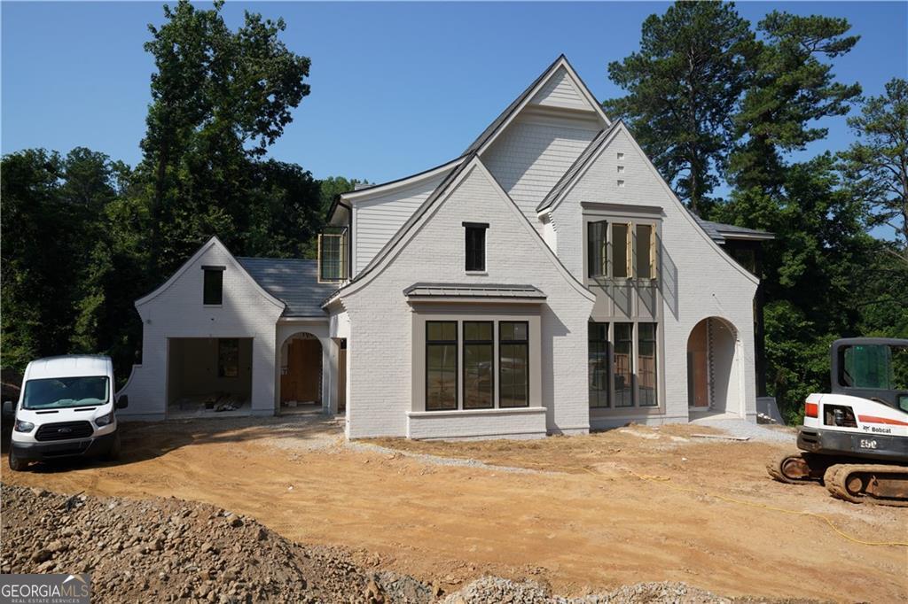 Luxury new construction being built by award-winning Loudermilk Homes in the exclusive and private new 11-home enclave, Blue Heron Walk. This highly sought-after Buckhead location is just minutes to offices, shopping, restaurants, and major highways, yet steps away from the Blue Heron Nature Preserve urban forest featuring 30 acres of natural woodlands and miles of walking trails. This exceptional residence has a modern and thoughtfully designed floor plan with 11 ft ceilings on the main and 10 ft ceilings upstairs. Highlights include 6 en-suite bedrooms with the primary suite upstairs, a guest bedroom on the main level, a guest bedroom in basement, gourmet chef's kitchen, home office, full finished daylight basement, 3-car garage, and a dramatic window-clad staircase bringing the outside in. With light-filled rooms and a covered porch overlooking the changing seasons of the nature preserve, this home is truly built for privacy and the tranquility of nature.