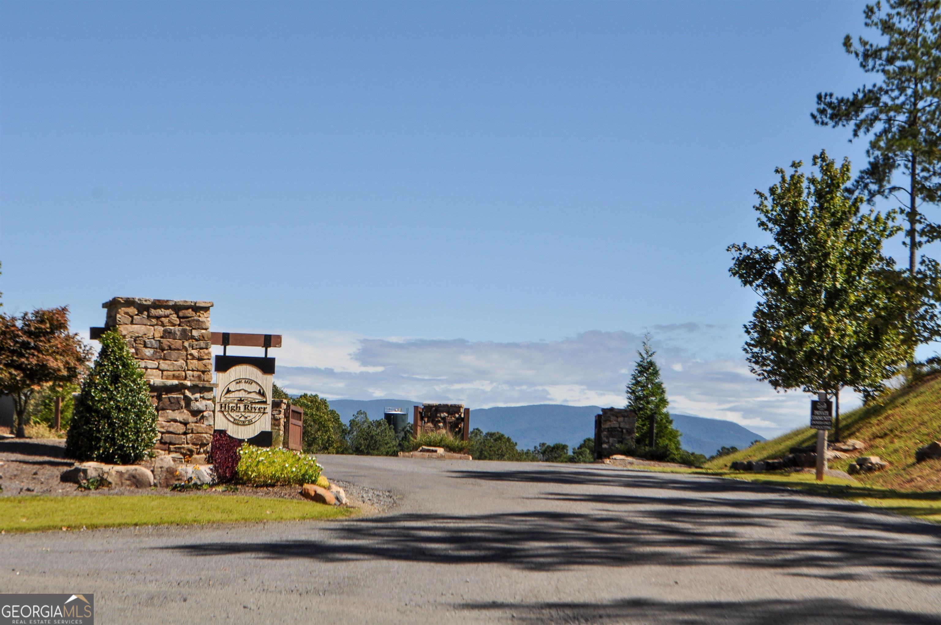 3.18 acres in the sought after High River subdivision! Beautiful lot with mature hardwoods and spectacular Mountain View's. Gated community surrounded by breath taking Mountain View's. This community also offers year-round River Access, access to the private, Lake Lecroy, quiet parklike settings throughout the subdivision, paved roads, streetlights and more! Come build the home of your dreams in this beautiful North Georgia community!