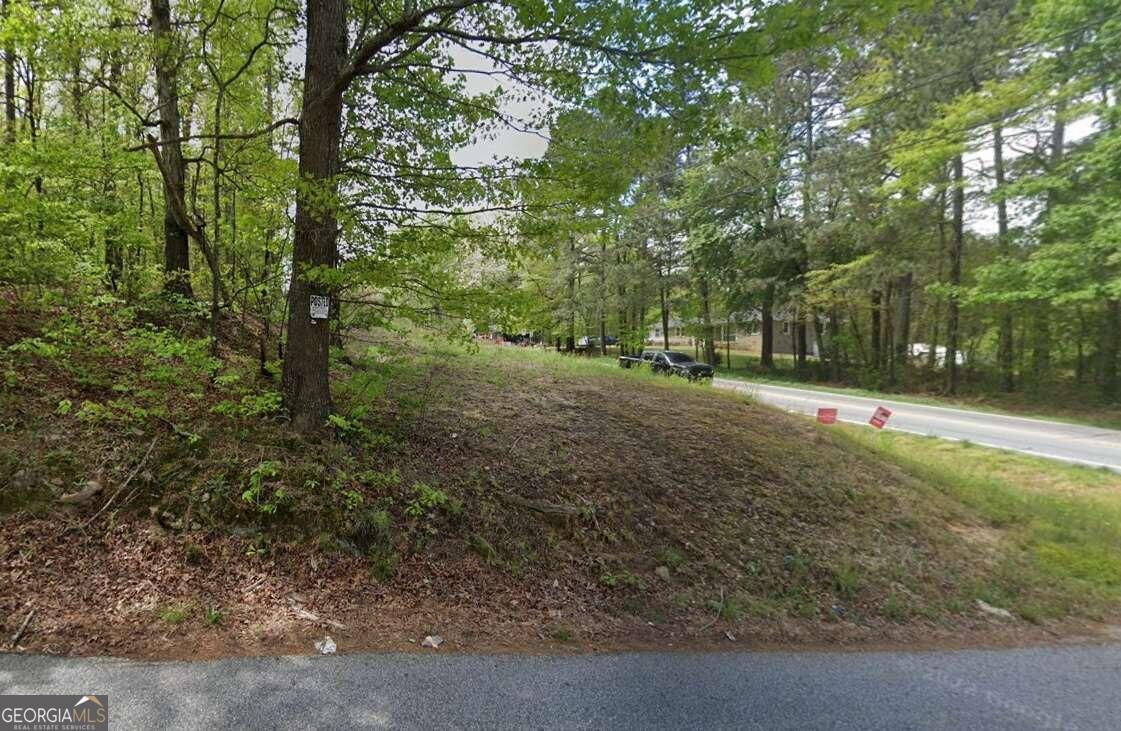 Seize a rare opportunity to own nearly 23 acres of prime, wooded land located at the highly sought-after corner of Carson Wages Road and Hwy 81 within the Winder city limits. This versatile property is ideal for creating an expansive estate or developing several homes. Key Features: Size & Topography: Boasting approximately 22.91 acres of gently rolling terrain with a natural wooded landscape, this property offers a serene and private setting. Road Frontage: The property features a generous 1,940 feet of frontage on Carson Wages Road and 351 feet on Hwy 81, providing excellent visibility and accessibility. Location: Situated in the growing area of Barrow County, this land benefits from its proximity to local amenities and the expanding community of Winder. Zoning & Land Use: Currently zoned AR1, which supports agricultural and residential uses. The future land use plan designates the area for Suburban Residential, offering potential for residential development. Utilities: Note that there is no sewer service currently available on the property. This prime piece of land is perfectly positioned for those looking to create a large, private estate or capitalize on the area's growth. With its abundant road frontage and desirable location within city limits, the possibilities are endless.