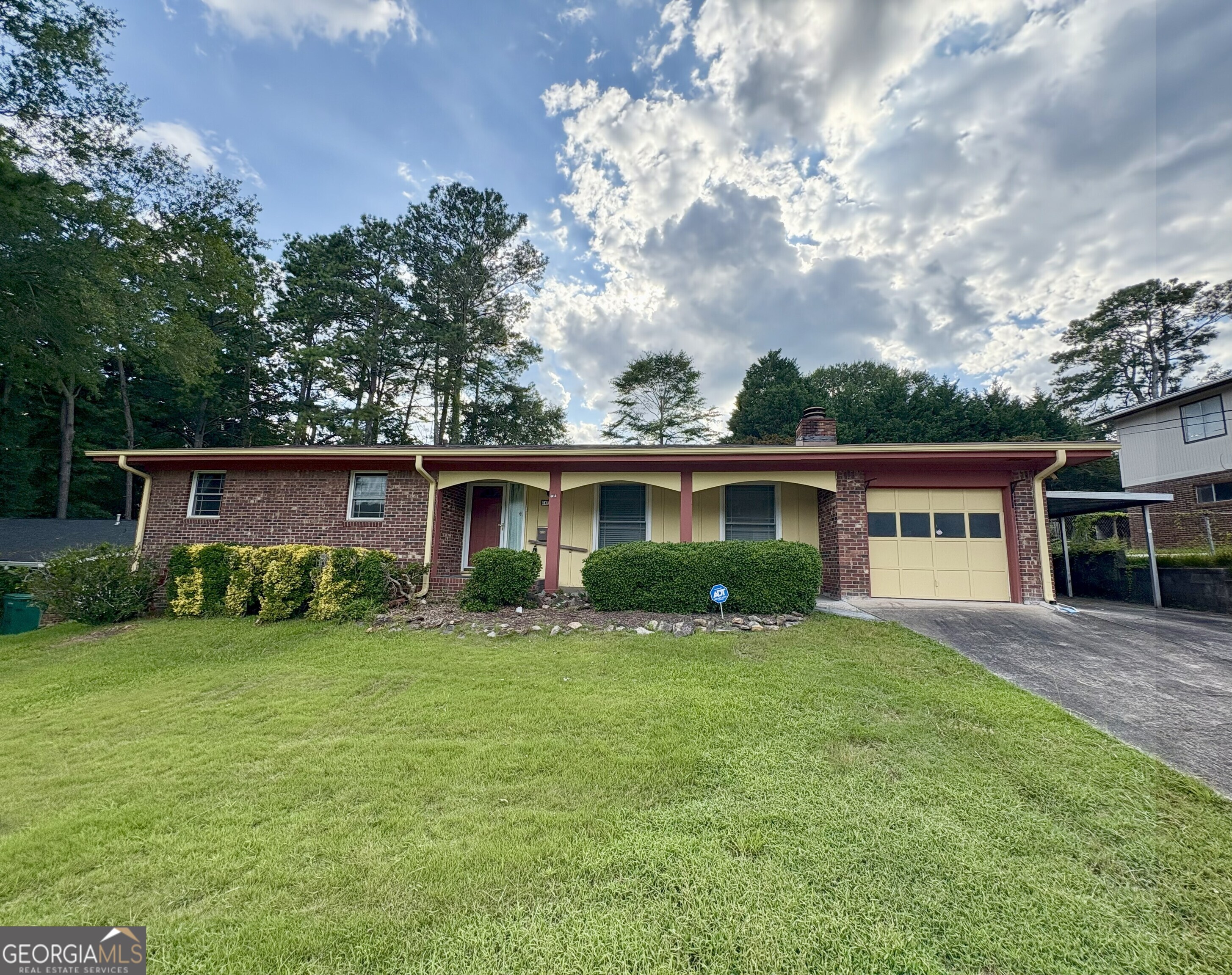 Great single level 4 sided brick home with huge potential. Your going to love walking into the open living and dining room, off to the back is the long private sun room, site back sipping your coffee and watching the birds. The kitchen is just off to the side of the dining area, with ample cabinets. This home is 3 bedroom 2 full baths and lays well. Attached 1 car garage and 1 car carport outside as well. The front yard is slightly slopped nothing too bad to maintain, and your going to love the private fenced back yard with storage shed/ Workshop. HVAC was replaced in 2016. Come take a look at this wonderful home just minutes from the park and tons of convenience.