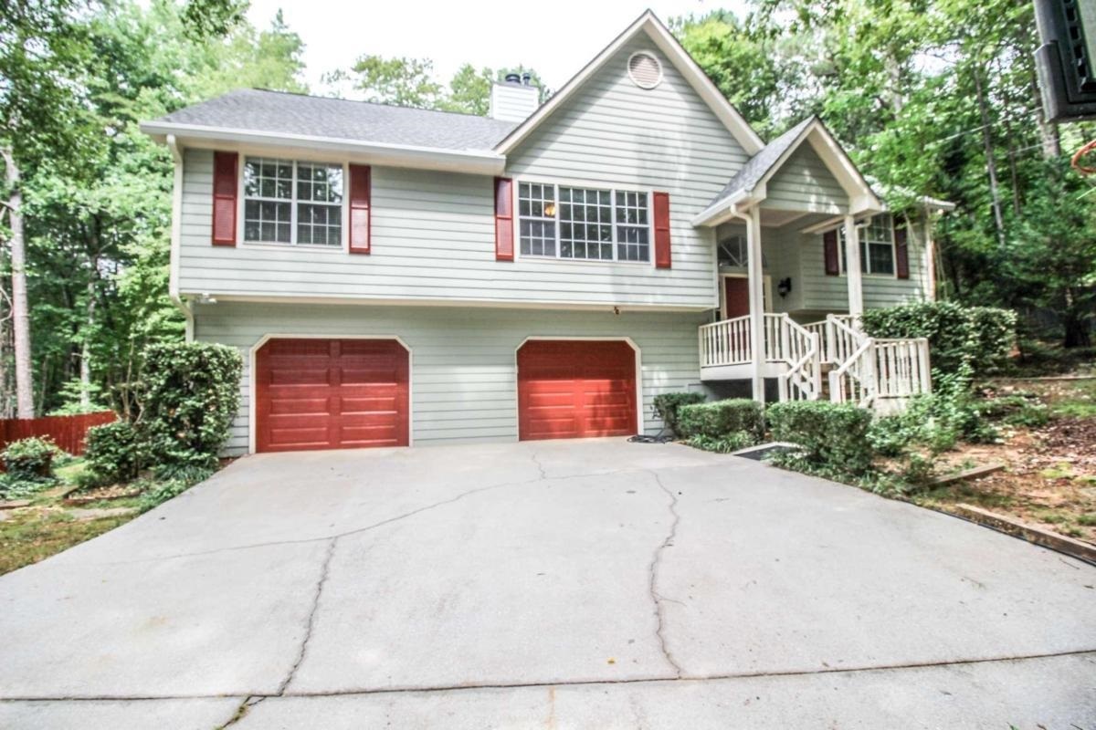 This home is located in a beautiful neighborhood located in sought after Chapel Hill Rd area. Inside you will find a double sided fireplace in the living/dining area. The kitchen has a view of it all.. the living and dining area. Off of the dining you will find a back deck that overlooks a flat, spacious backyard that's relaxing and private with a mature magnolia, gardenias, hydrangeas, and crepe myrtles on every corner of the home. The master bedroom has trey ceilings and the large master bath has a walk-in closet, double vanity, and separate tub/shower.  On the lower level you will find a finished bonus room or bedroom and bathroom that is plumbed for shower. The garage has a great big shop area. The home has been freshly painted inside and out. It has a newer roof, hot water heater, and gutters/covers.