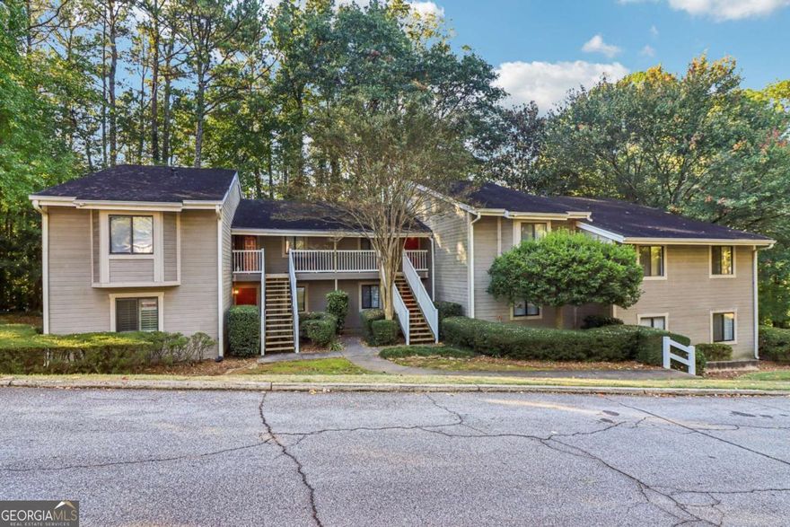 Perfect location in East Cobb & super close to The Battery. This updated 2 BR 2 Bath condo is move in ready for you to simply enjoy life. With a beautiful kitchen with all stainless steel appliances featuring granite countertops, great cabinets and large eating area as you enjoy views of the great room and fireplace. All the windows have wooden shutters along with hardwood flooring throughout. The one bedroom has large walk-in closets with lots of storage space. When the upgrades were done all the ceiling are flat without texture. Recessed lighting enhances your experience. The HVAC was replaced in October2024, the HOA replaced all plumbing lines in June 2024.  This unit is stepless which is a plus for many. The community is active and just 2.3 miles  to Braves games, concerts and the great activities at the Battery. This is a must see unit and we welcome your showings!