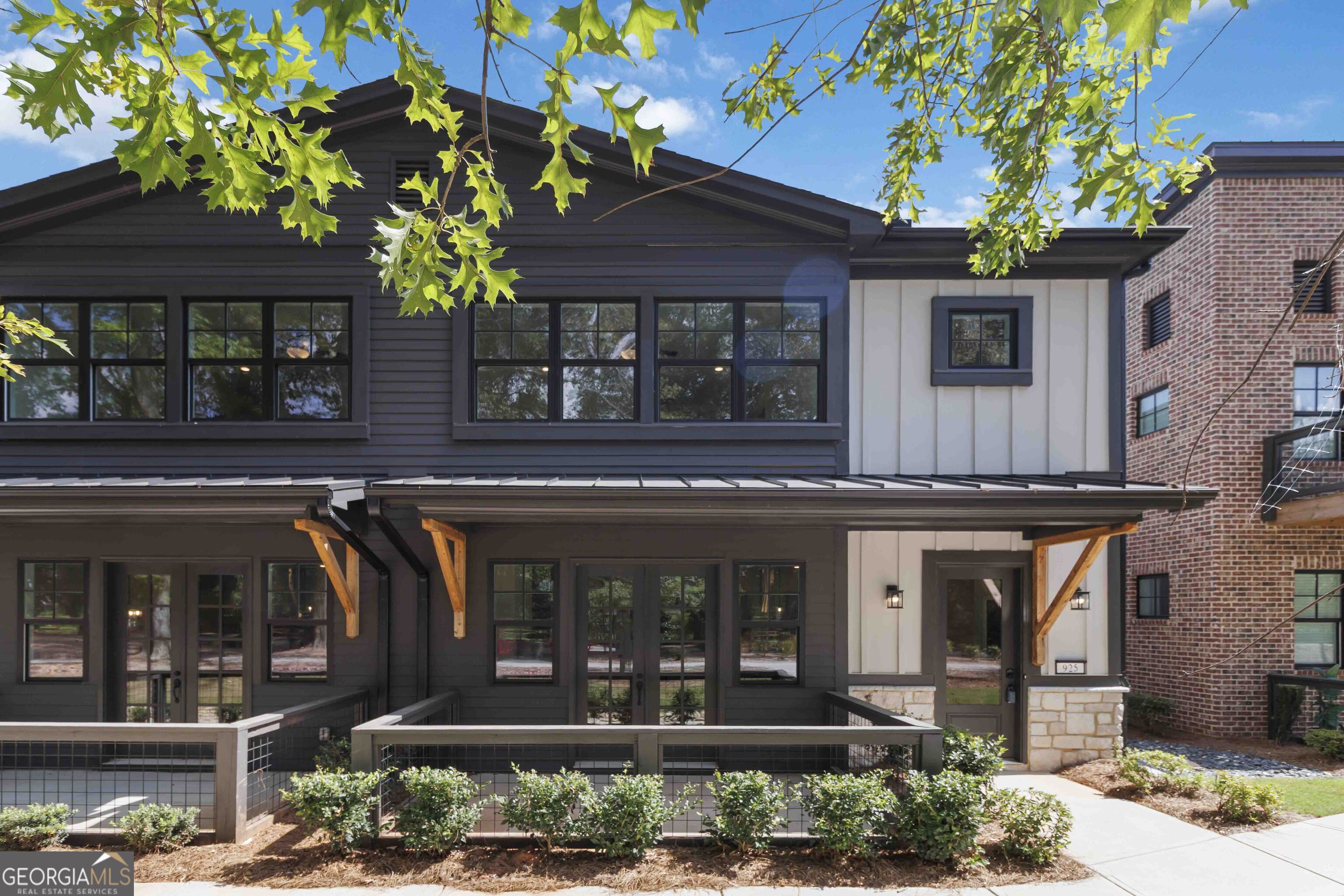 This Gorgeous New Construction Townhome is ready now with 10' ceilings on the main level, LVP flooring, wood stair treads, designer lighting, and black hardware finishes. Beautiful Kitchen with 42" Stained Steel Gray Cabinets, Quartz countertops, subway tile backsplash, stainless appliances, and a walk-in pantry. Owner's suites feature walk-in closets, Quartz vanity, and tiled shower with Glass Shower door. Upstairs also includes two additional bedrooms with walk-in closets and a full laundry room. Serenity townhomes include high-efficiency R-38 attic insulation, 17-SEER zoned HVAC, Low-E windows, and a smart energy package. Exteriors feature fiber cement siding, brick accents (per plan), Front Porch, professional landscaping, 30-year architectural shingles, and lawn irrigation. Additional features include a smart garage opener, rear-entry 2-car garages, 50-gal water heater, and a comprehensive builder warranty. Serenity is a small community of 25 spacious townhomes in vibrant Hapeville, GA, located just minutes from downtown Atlanta and Hartsfield-Jackson Airport, Serenity offers walkability to Hapeville's artsy downtown, eclectic dining, and creative spaces. Close to Porsche HQ, Delta, and Chick-fil-A's original Dwarf House, this community blends modern comfort with convenience and culture.