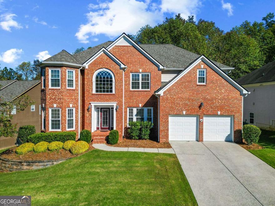 Mansion style home in beautiful south west Forsyth County! Step inside this stunning 8-bedroom, 5-bath home in one of Cumming's premier swim and tennis communities-where nearly 5,500 square feet of beautifully finished space blends elegance, light, and livability. Gleaming hardwoods span the main level, complemented by brand-new double-pane windows throughout and a four-year-old roof. From its open layout to its thoughtful details, this home offers space and comfort rarely found at this level. The main floor centers around an impressive kitchen-an oversized island overlooks the great room and a wall of windows with views of the wooded backyard. A generous dining room, full guest suite with attached bath, and multiple living areas make entertaining effortless. Upstairs features five bedrooms including a stunning primary suite with dual walk-in closets, spa-inspired bath, and private laundry. The finished terrace level adds versatility with two bedrooms, a full bath, a large media or recreation room, and pre-wiring for a kitchenette-ideal for guests or an in-law suite. Out back, enjoy a large deck overlooking the landscaped, wooded yard. With an unbeatable location just minutes from GA-400, The Collection, and Cumming City Center, this home is zoned for Vickery Creek Middle and the coveted West Forsyth High School.    Spacious, bright, and beautifully maintained-this one checks every box.